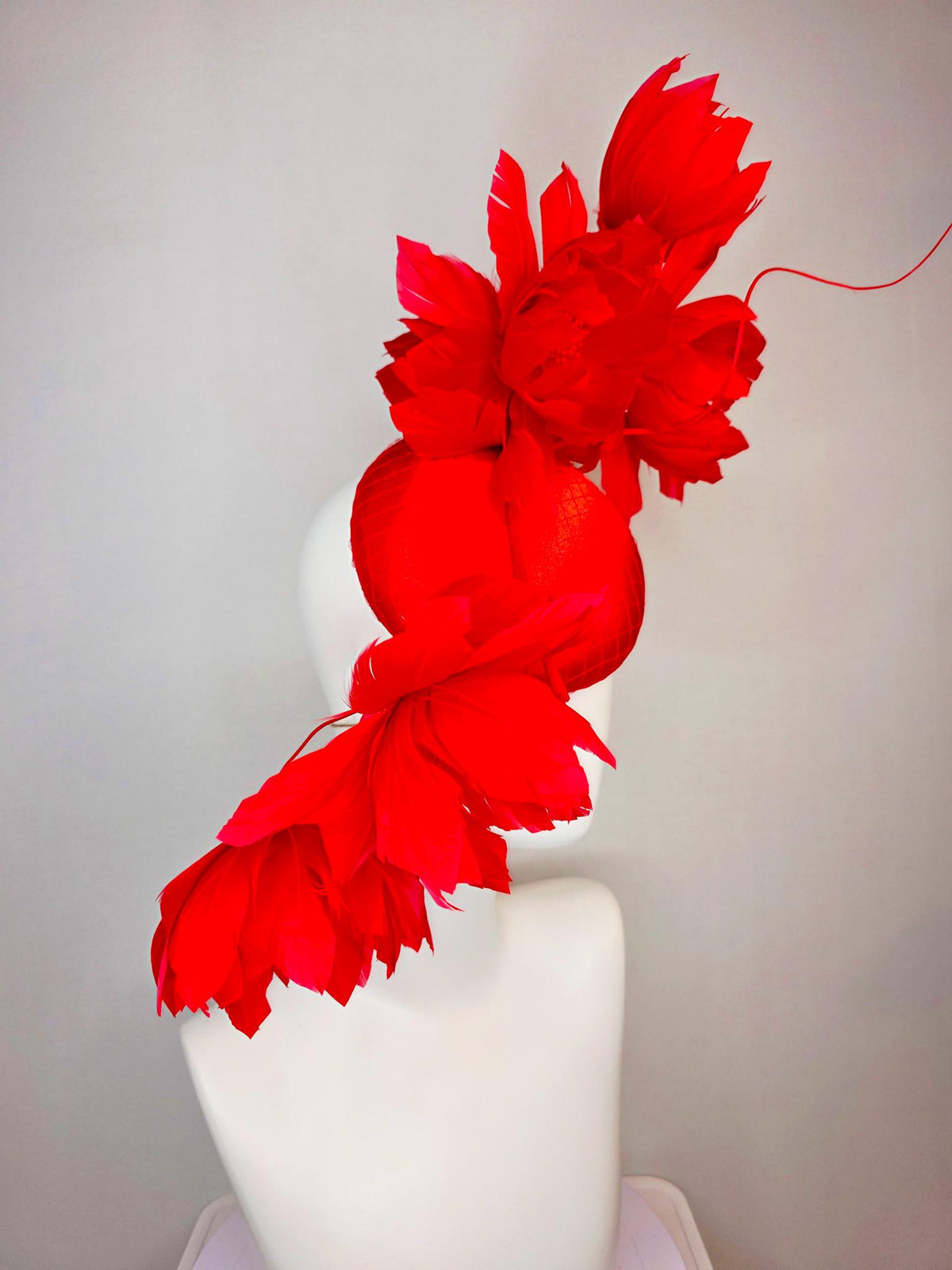 kentucky derby hat fascinator bright red satin with netting and large fluffy bright scarlet red feather flowers and red feathers