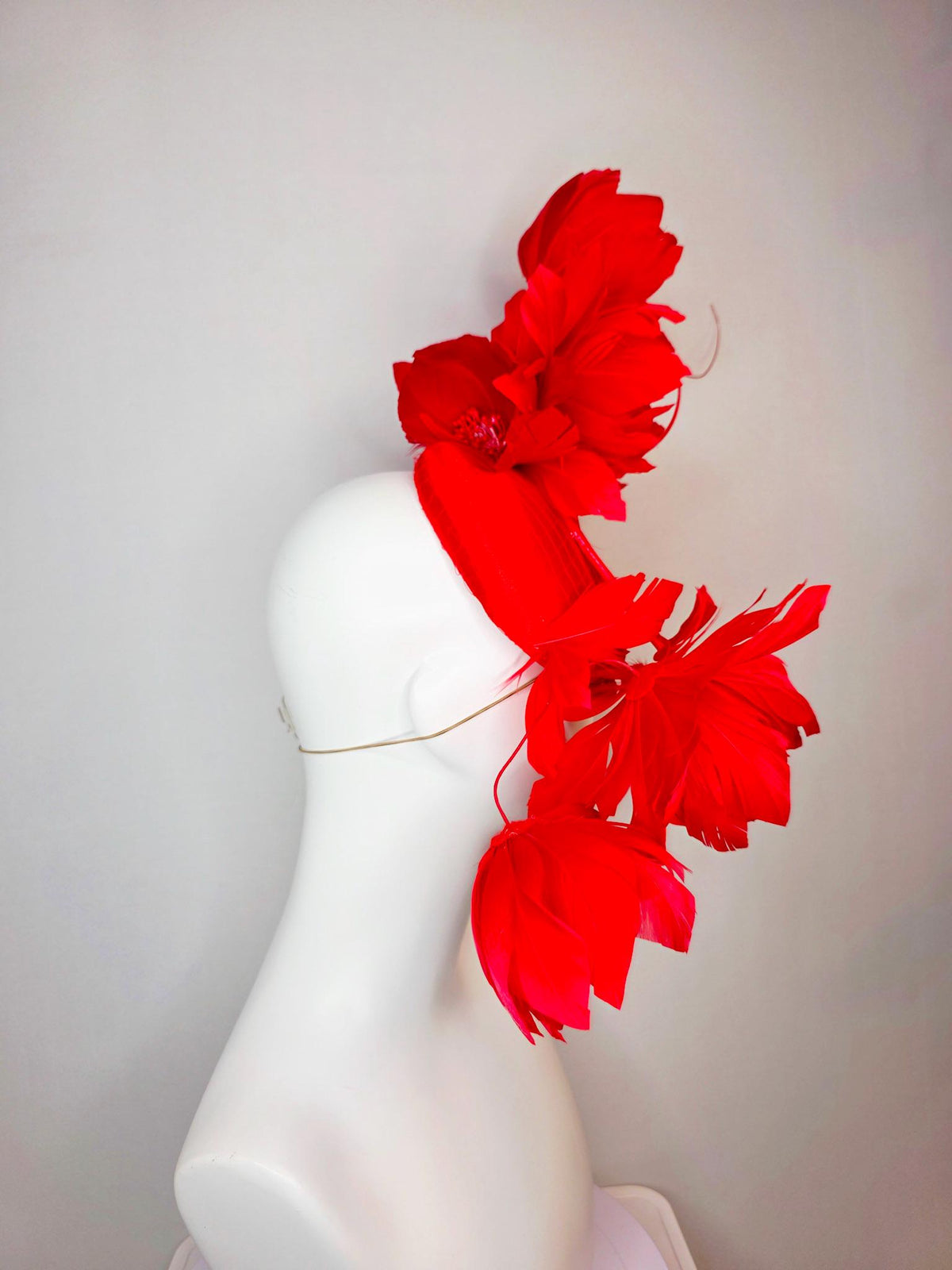 kentucky derby hat fascinator bright red satin with netting and large fluffy bright scarlet red feather flowers and red feathers