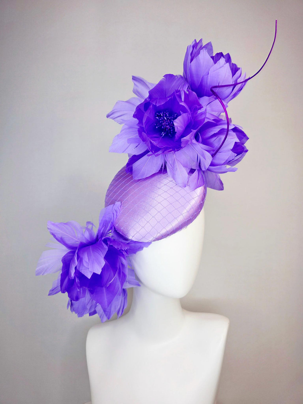 kentucky derby hat fascinator lavender purple satin with netting and large fluffy violet purple feather flowers and light purple feathers