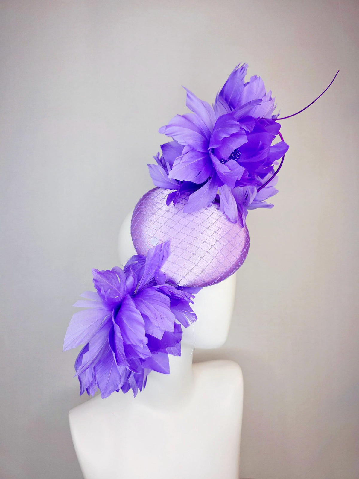kentucky derby hat fascinator lavender purple satin with netting and large fluffy violet purple feather flowers and light purple feathers