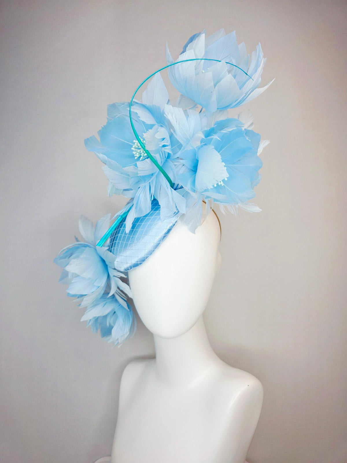 kentucky derby hat fascinator light blue satin with netting and large fluffy sky blue feather flowers and baby blue feathers