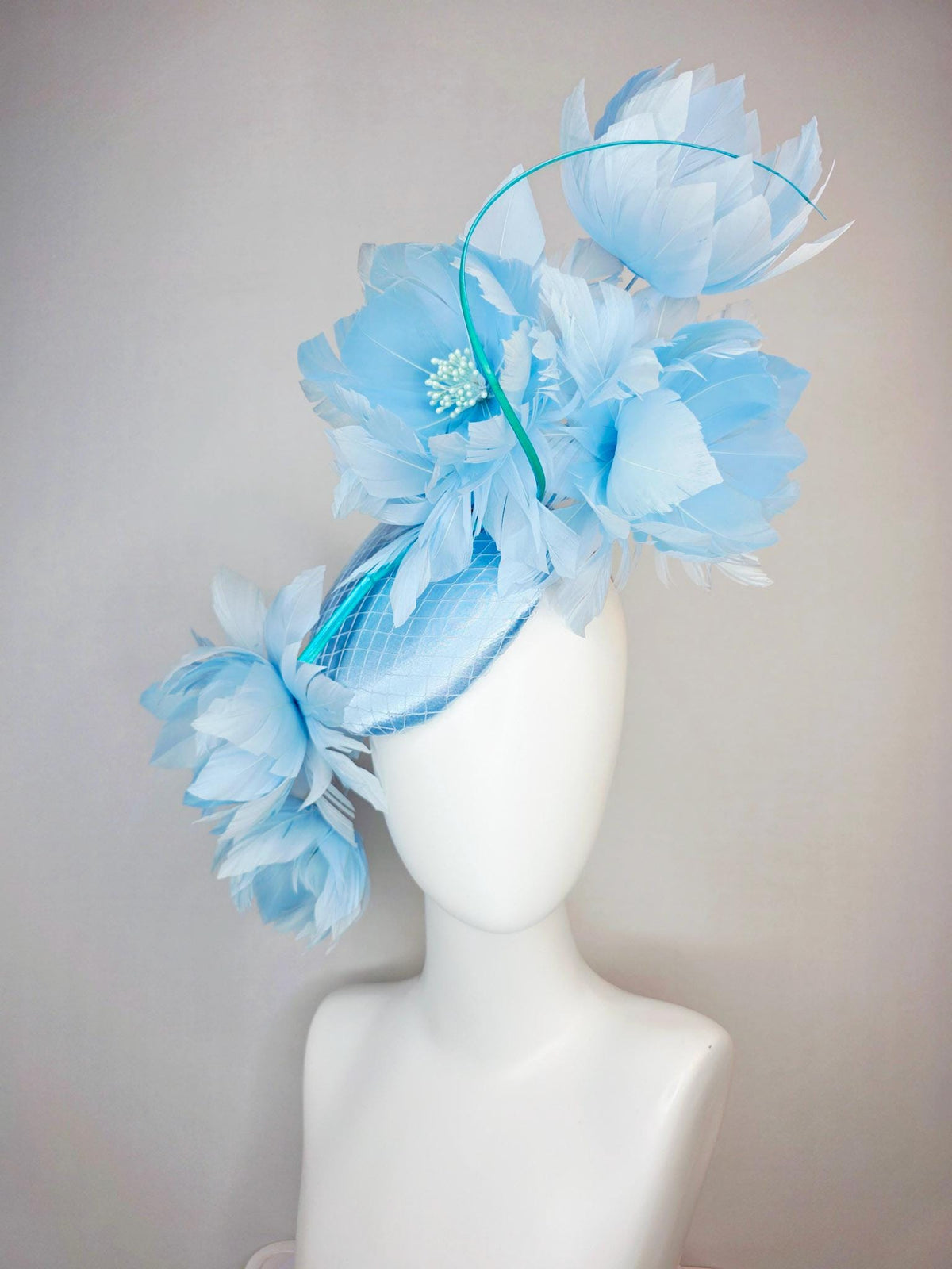 kentucky derby hat fascinator light blue satin with netting and large fluffy sky blue feather flowers and baby blue feathers
