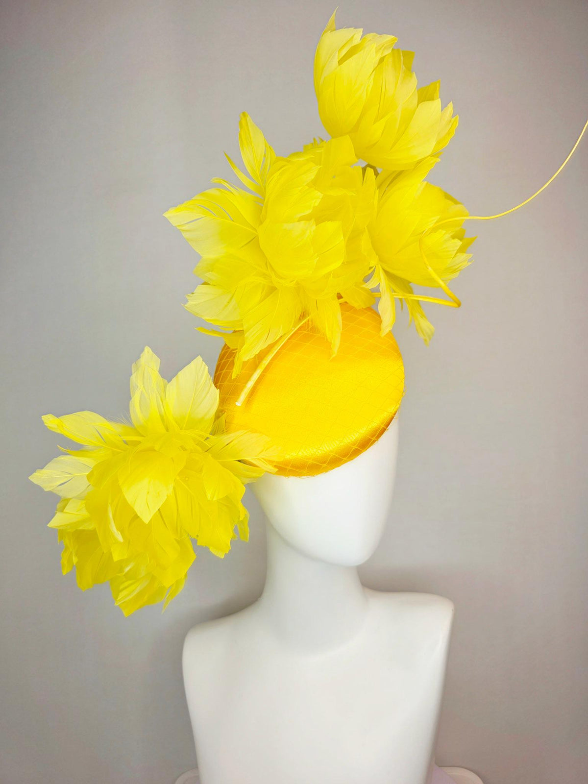 kentucky derby hat fascinator gold yellow satin with netting and large fluffy yellow feather flowers and yellow feathers