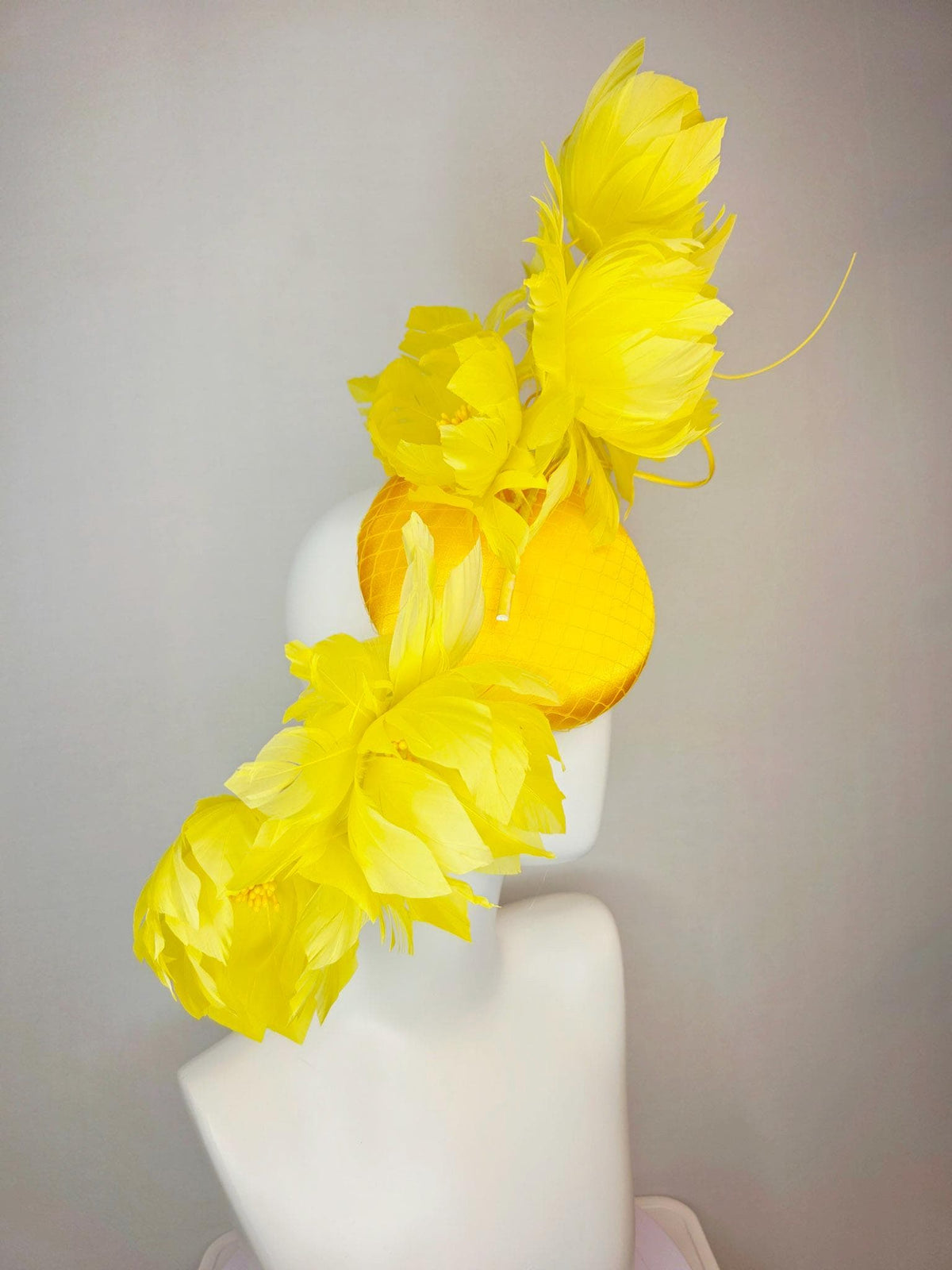 kentucky derby hat fascinator gold yellow satin with netting and large fluffy yellow feather flowers and yellow feathers