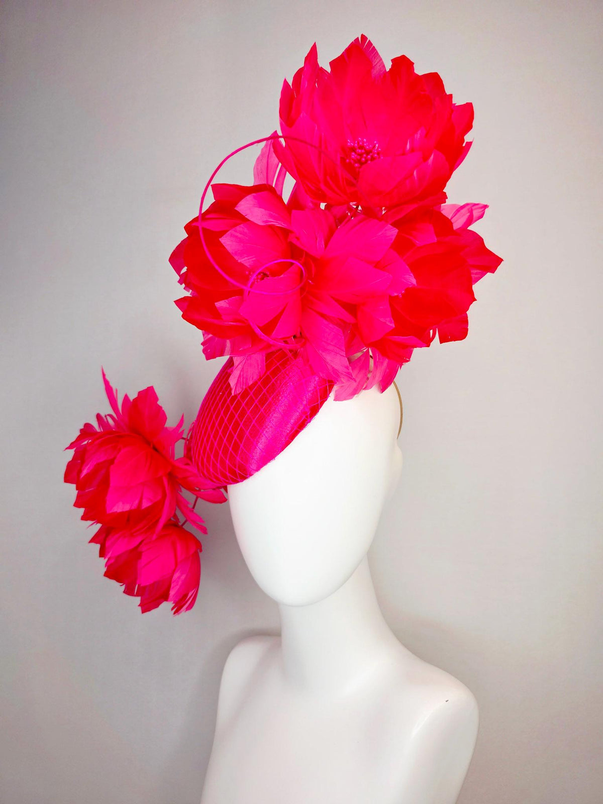 kentucky derby hat fascinator hot raspberry pink satin with netting and large fluffy red feather flowers with fuchsia pink feathers