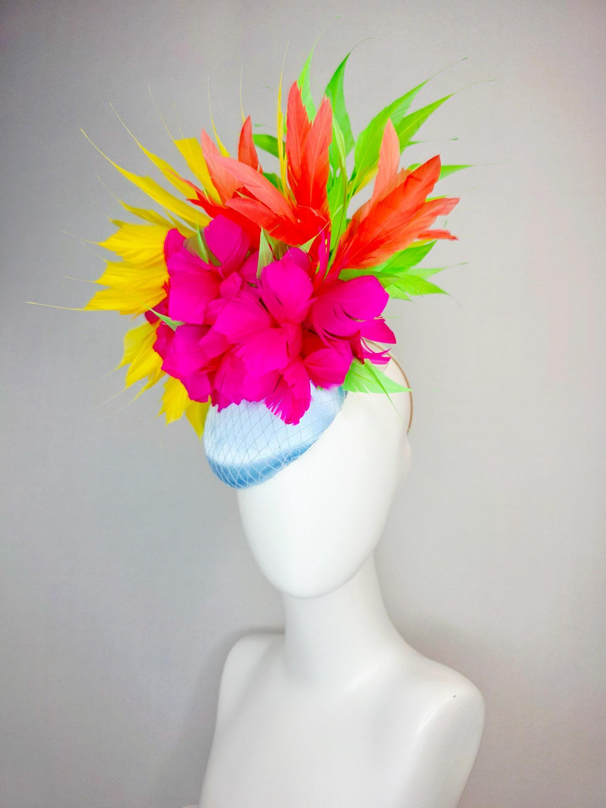kentucky derby hat fascinator light blue satin with netting fuchsia pink fluffy feathers and yellow orange lime green branching feathers
