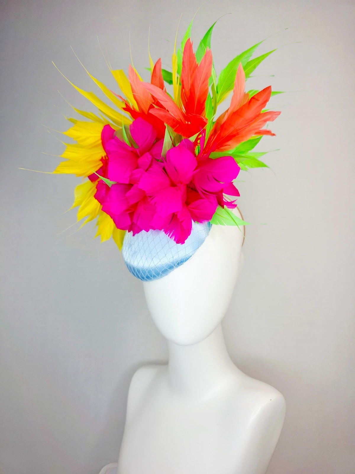 kentucky derby hat fascinator light blue satin with netting fuchsia pink fluffy feathers and yellow orange lime green branching feathers