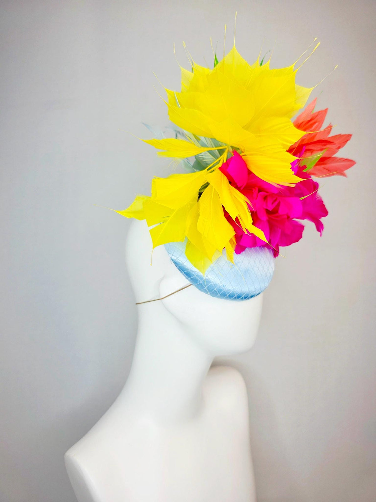 kentucky derby hat fascinator light blue satin with netting fuchsia pink fluffy feathers and yellow orange lime green branching feathers