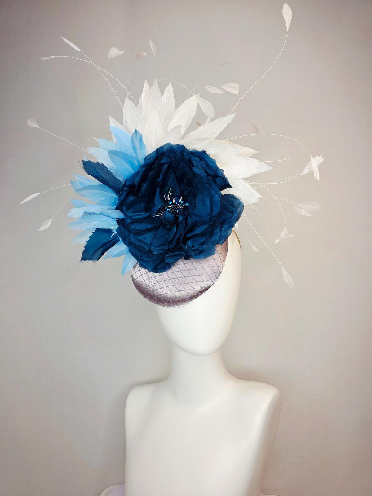 kentucky derby hat fascinator silver gray satin with netting large navy blue organza rose flower with sky blue and white branching feathers