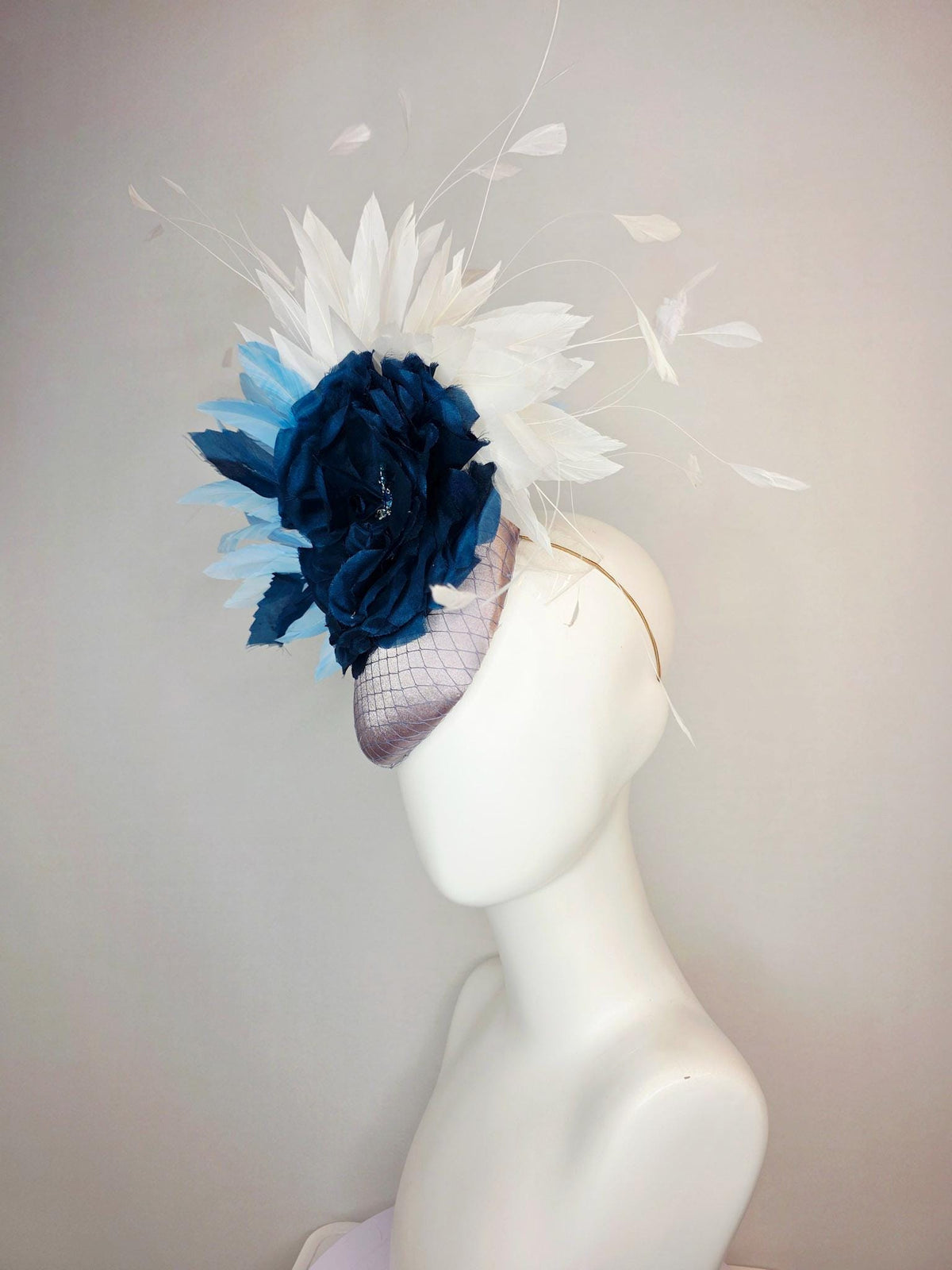 kentucky derby hat fascinator silver gray satin with netting large navy blue organza rose flower with sky blue and white branching feathers