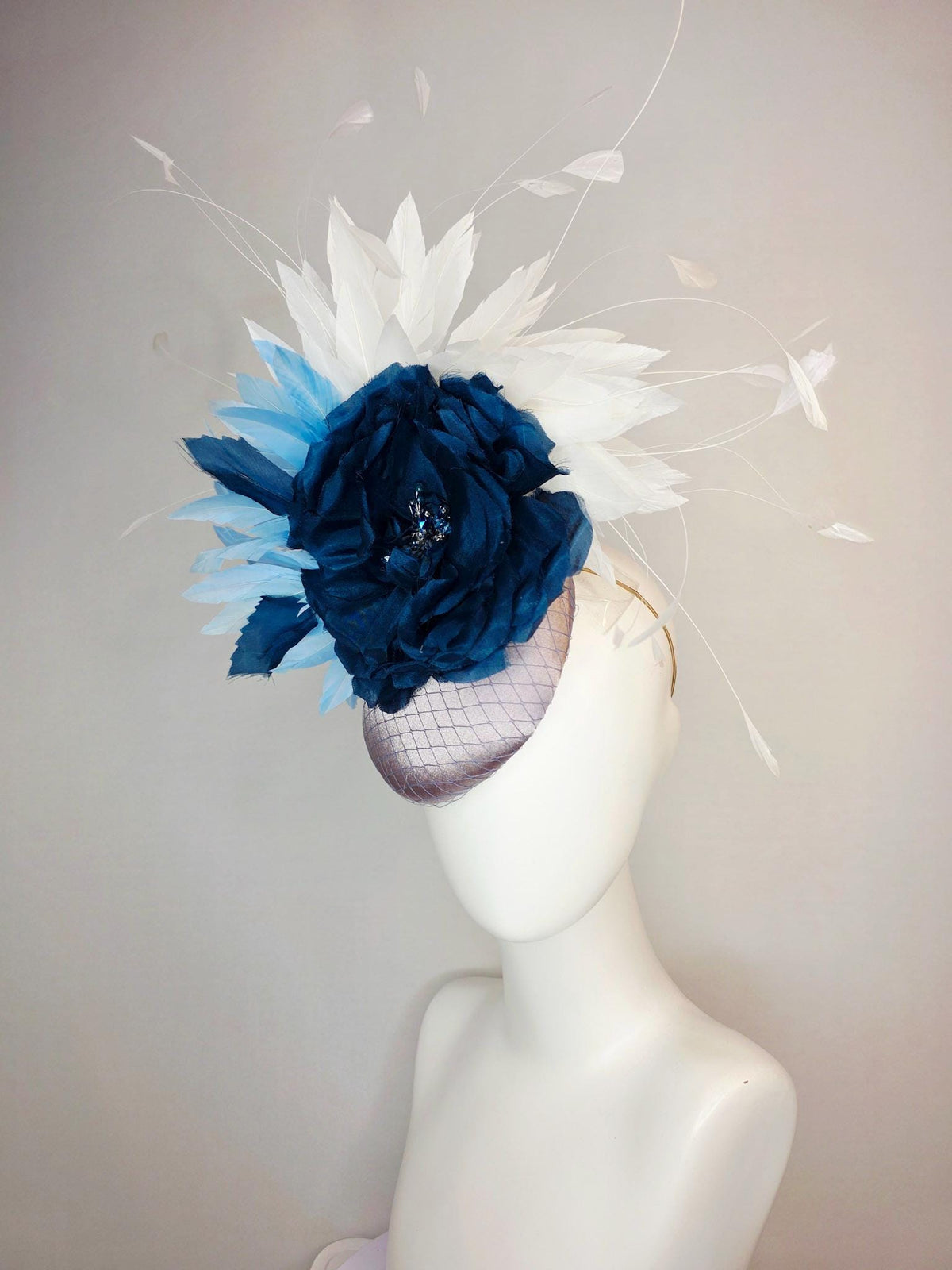 kentucky derby hat fascinator silver gray satin with netting large navy blue organza rose flower with sky blue and white branching feathers