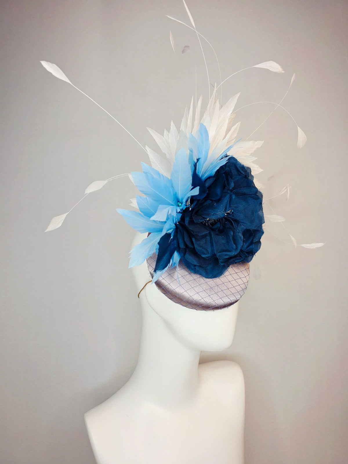 kentucky derby hat fascinator silver gray satin with netting large navy blue organza rose flower with sky blue and white branching feathers
