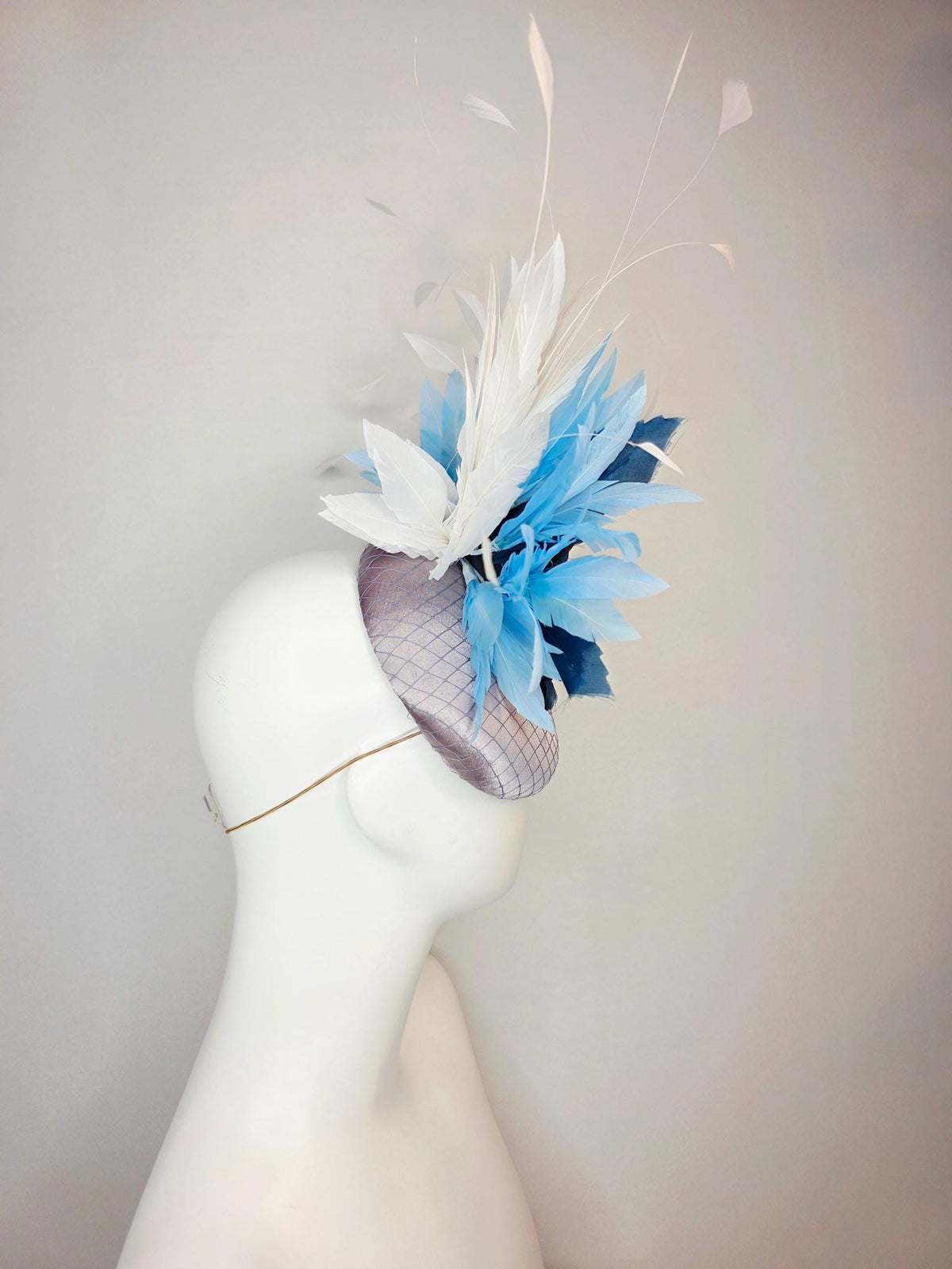 kentucky derby hat fascinator silver gray satin with netting large navy blue organza rose flower with sky blue and white branching feathers