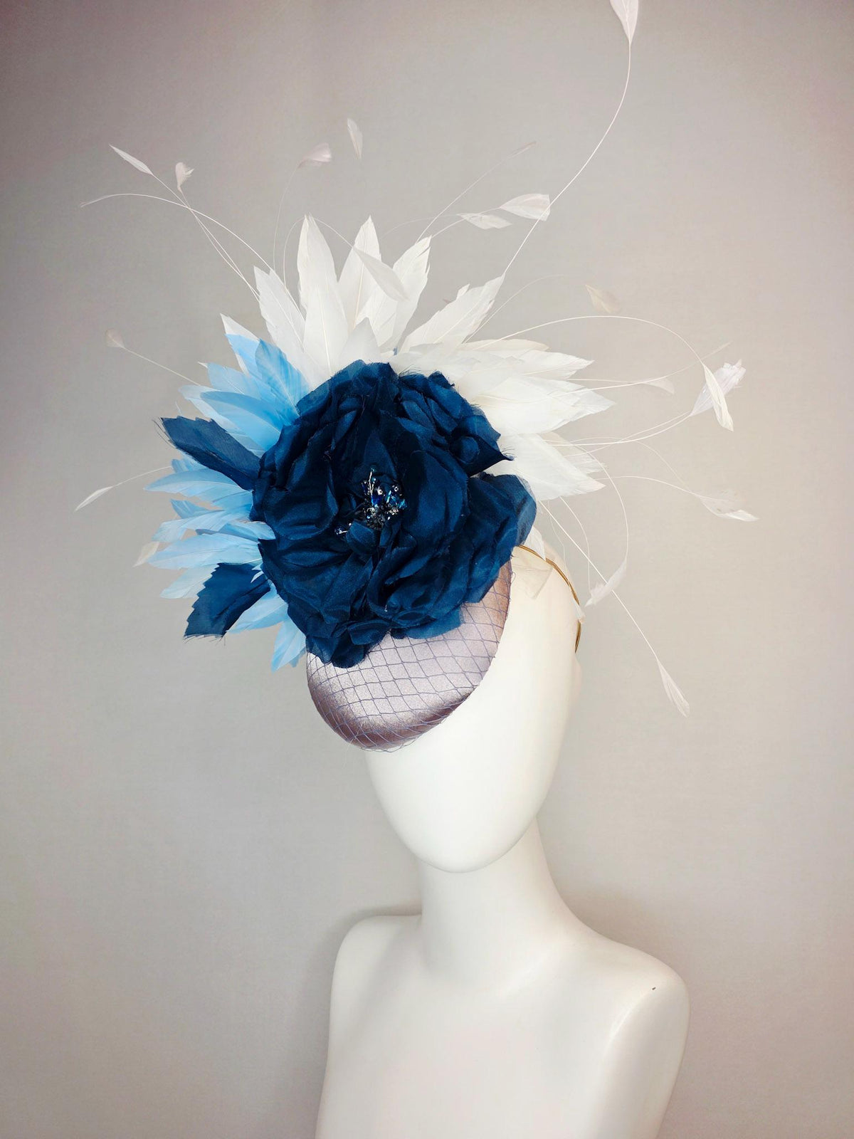 kentucky derby hat fascinator silver gray satin with netting large navy blue organza rose flower with sky blue and white branching feathers