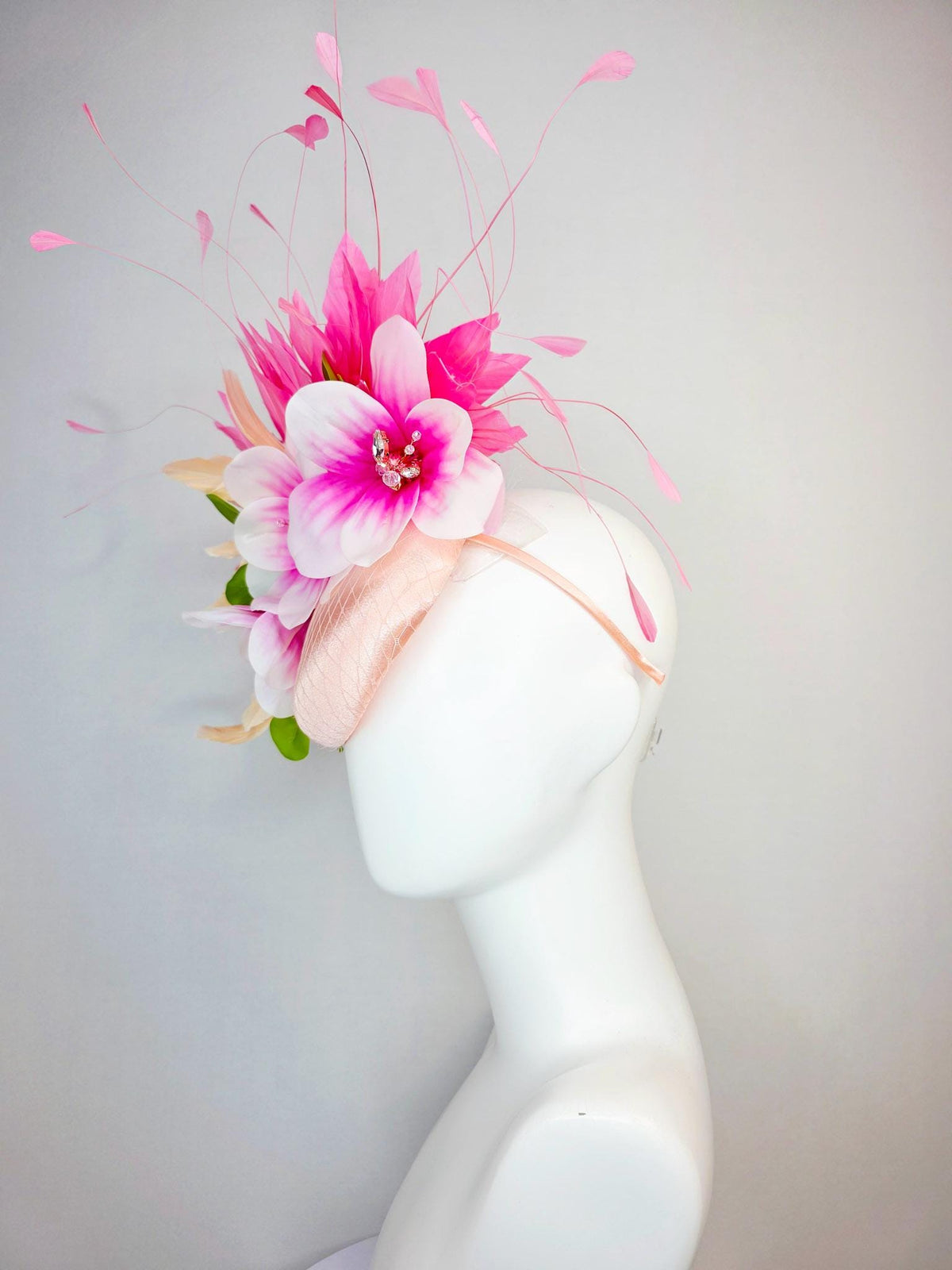 kentucky derby hat fascinator light pink satin with netting pink white satin flowers green leaves cream beige and hot pink fluffy feathers