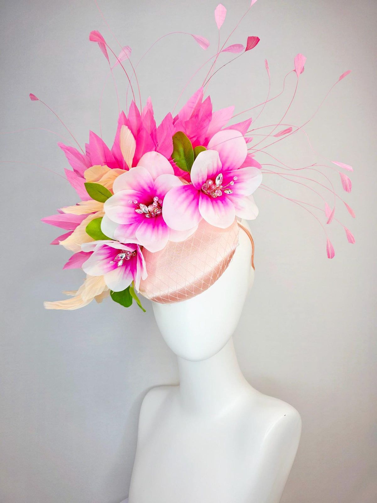 kentucky derby hat fascinator light pink satin with netting pink white satin flowers green leaves cream beige and hot pink fluffy feathers