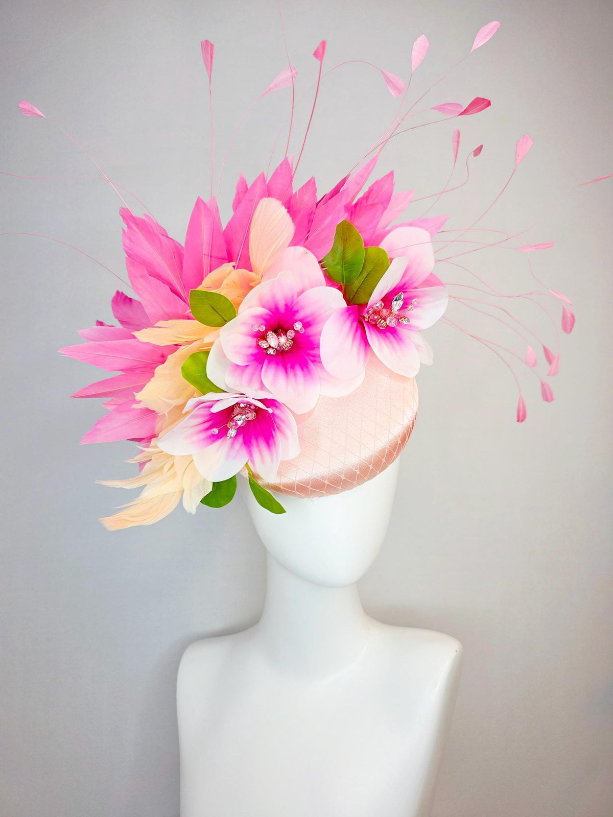 kentucky derby hat fascinator light pink satin with netting pink white satin flowers green leaves cream beige and hot pink fluffy feathers