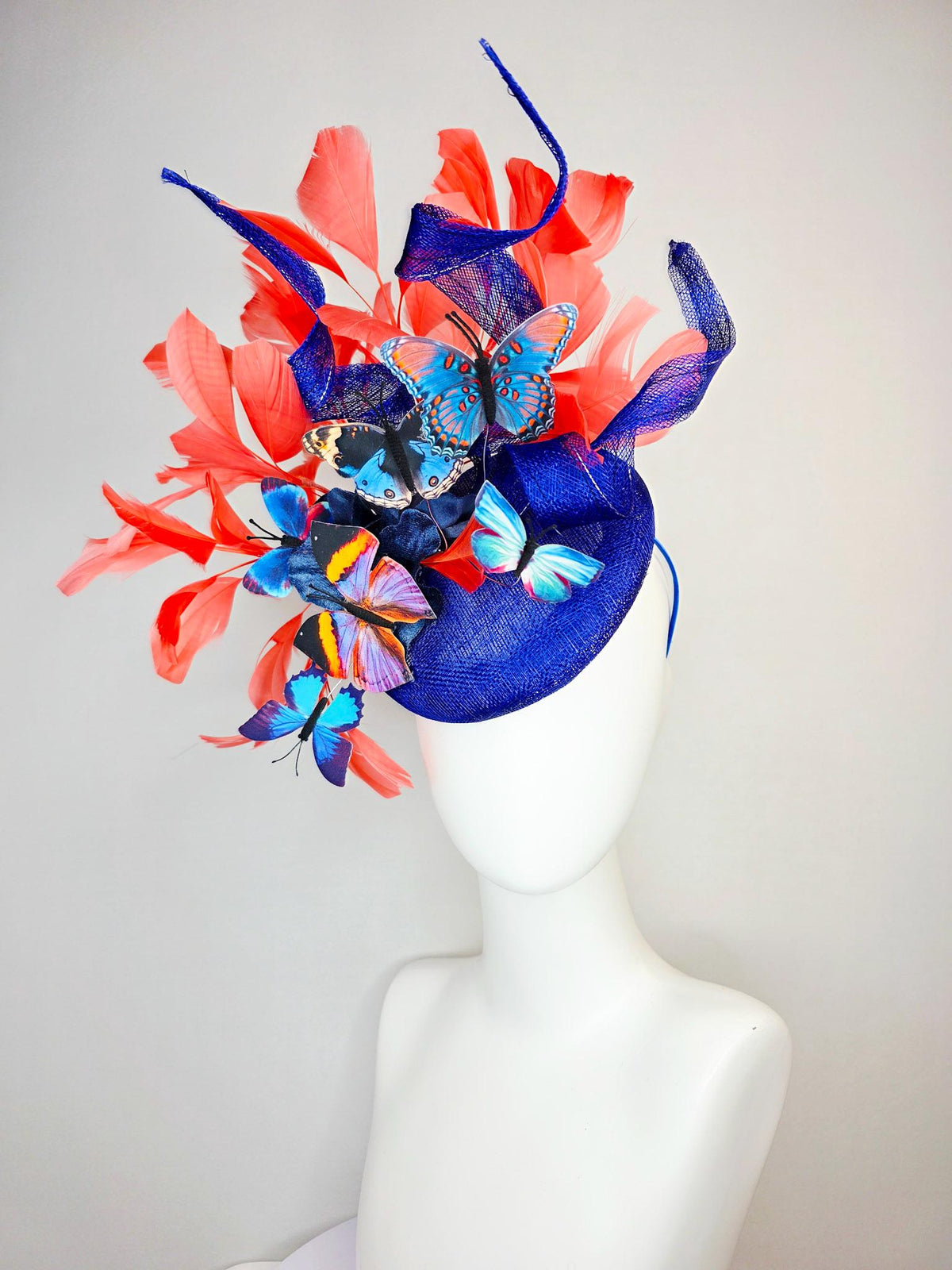 kentucky derby hat fascinator cobalt blue sinamay with curls royal blue organza flower coral orange feathers blue yellow black butterflies