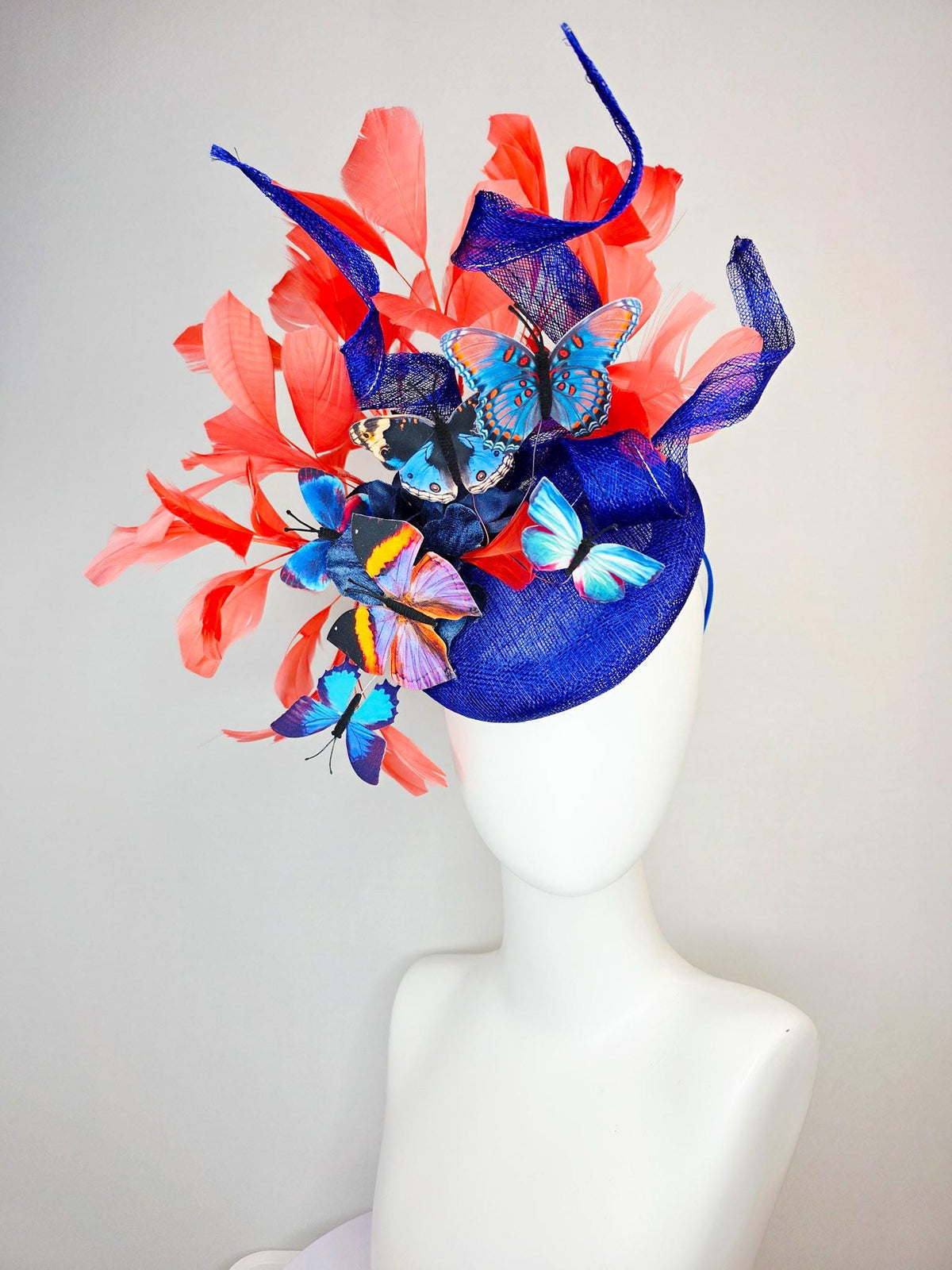 kentucky derby hat fascinator cobalt blue sinamay with curls royal blue organza flower coral orange feathers blue yellow black butterflies