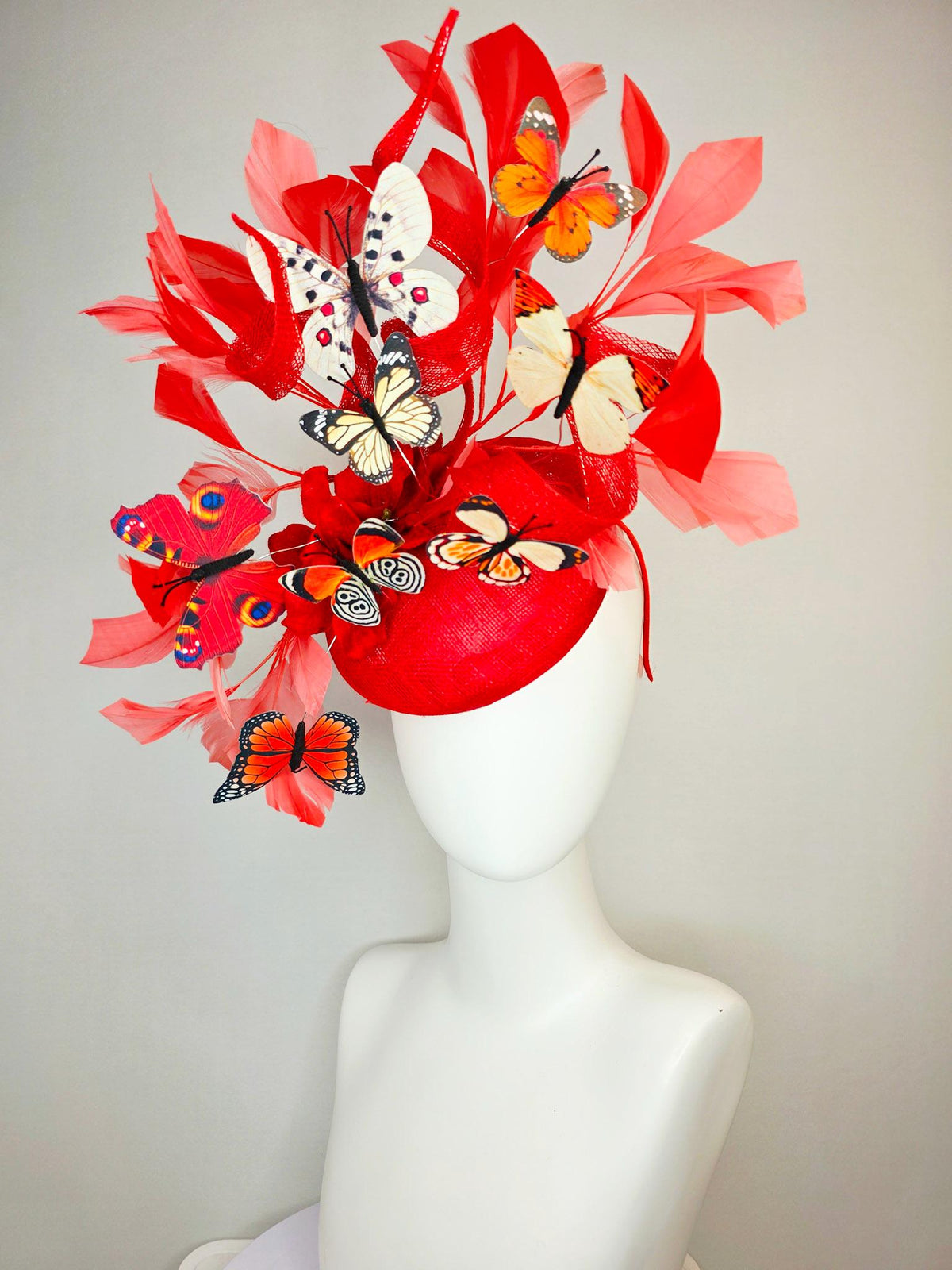 kentucky derby hat fascinator scarlet red sinamay with curls red organza flower coral red feathers white cream orange blue black butterflies