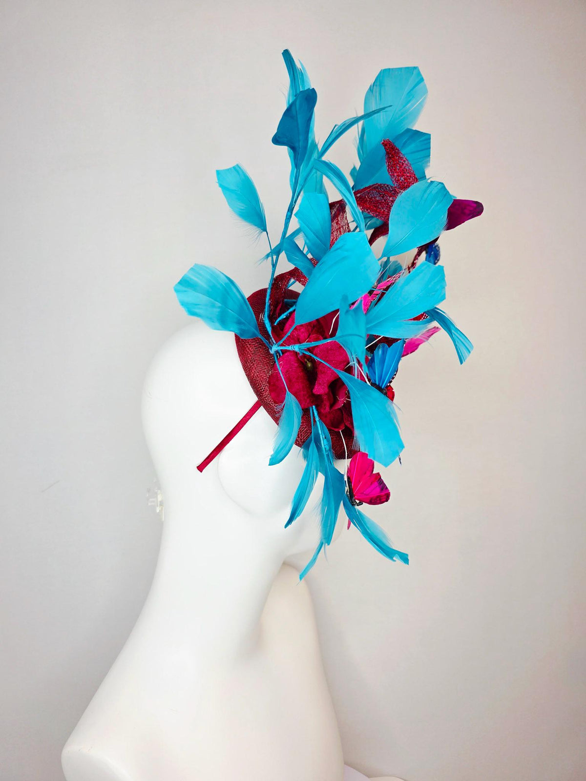 kentucky derby hat fascinator burgundy red sinamay with curls wine red organza flower turquoise sky blue feathers blue pink red butterflies