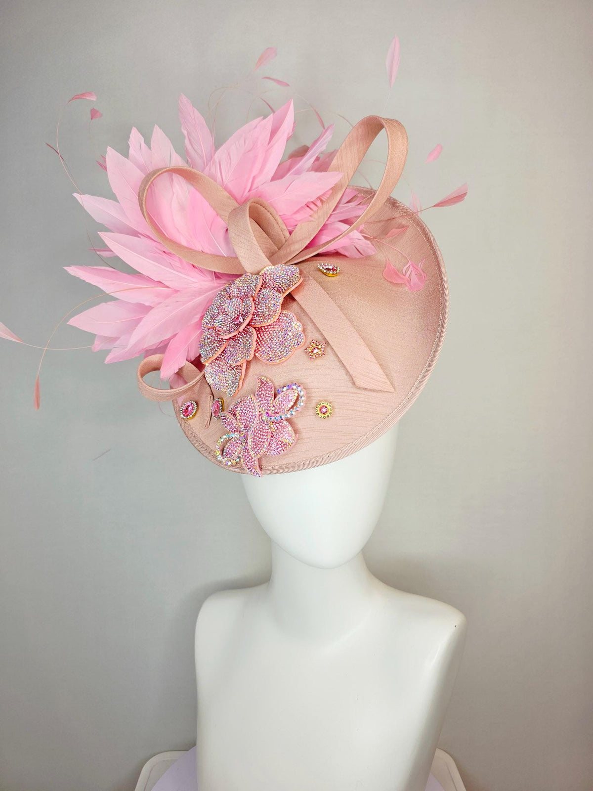 kentucky derby hat fascinator champagne pink shantung saucer with shantung bow iridescent pink crystal rhinestone flowers baby pink feathers