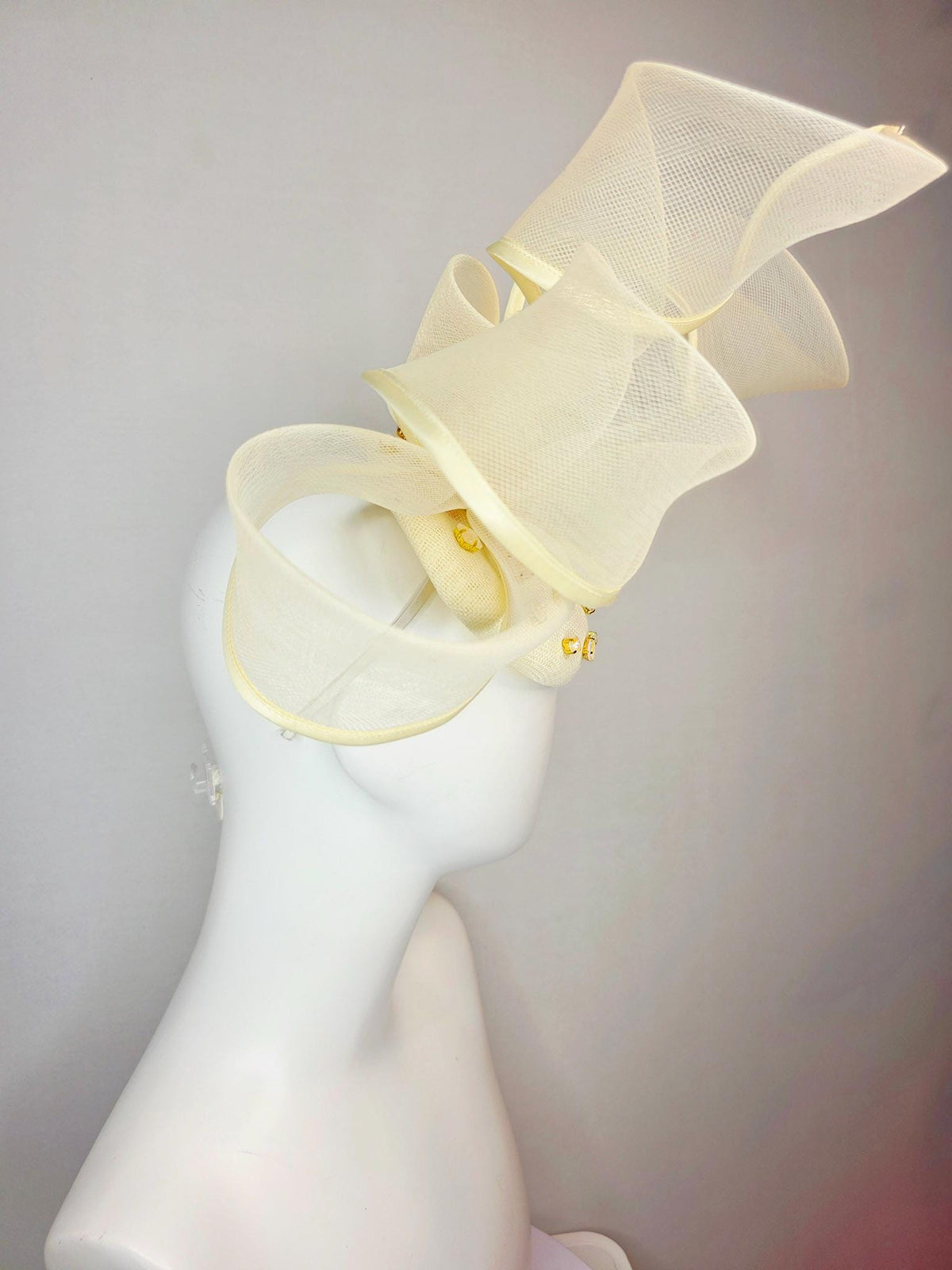 kentucky derby hat fascinator light yellow sinamay base with iridescent yellow crystal jewels mesh wired ribbon large bendable bow decor