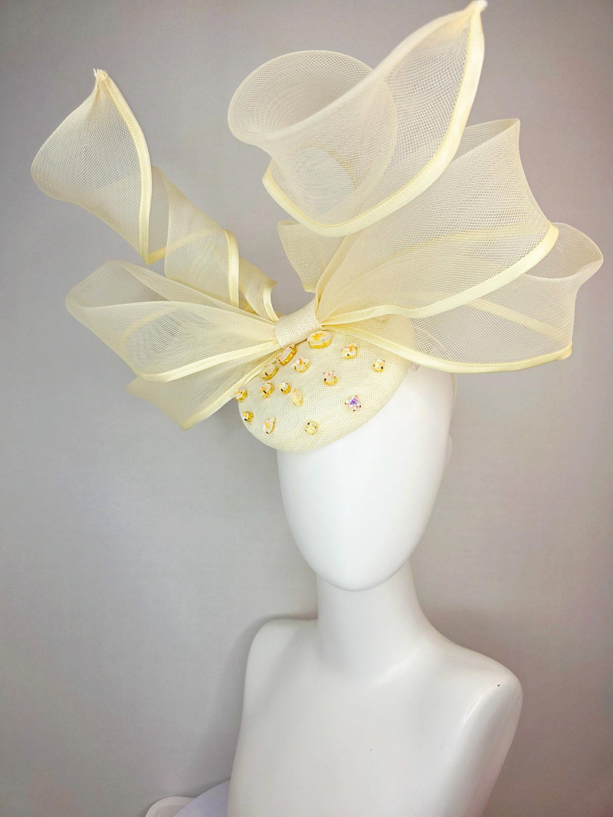 kentucky derby hat fascinator light yellow sinamay base with iridescent yellow crystal jewels mesh wired ribbon large bendable bow decor