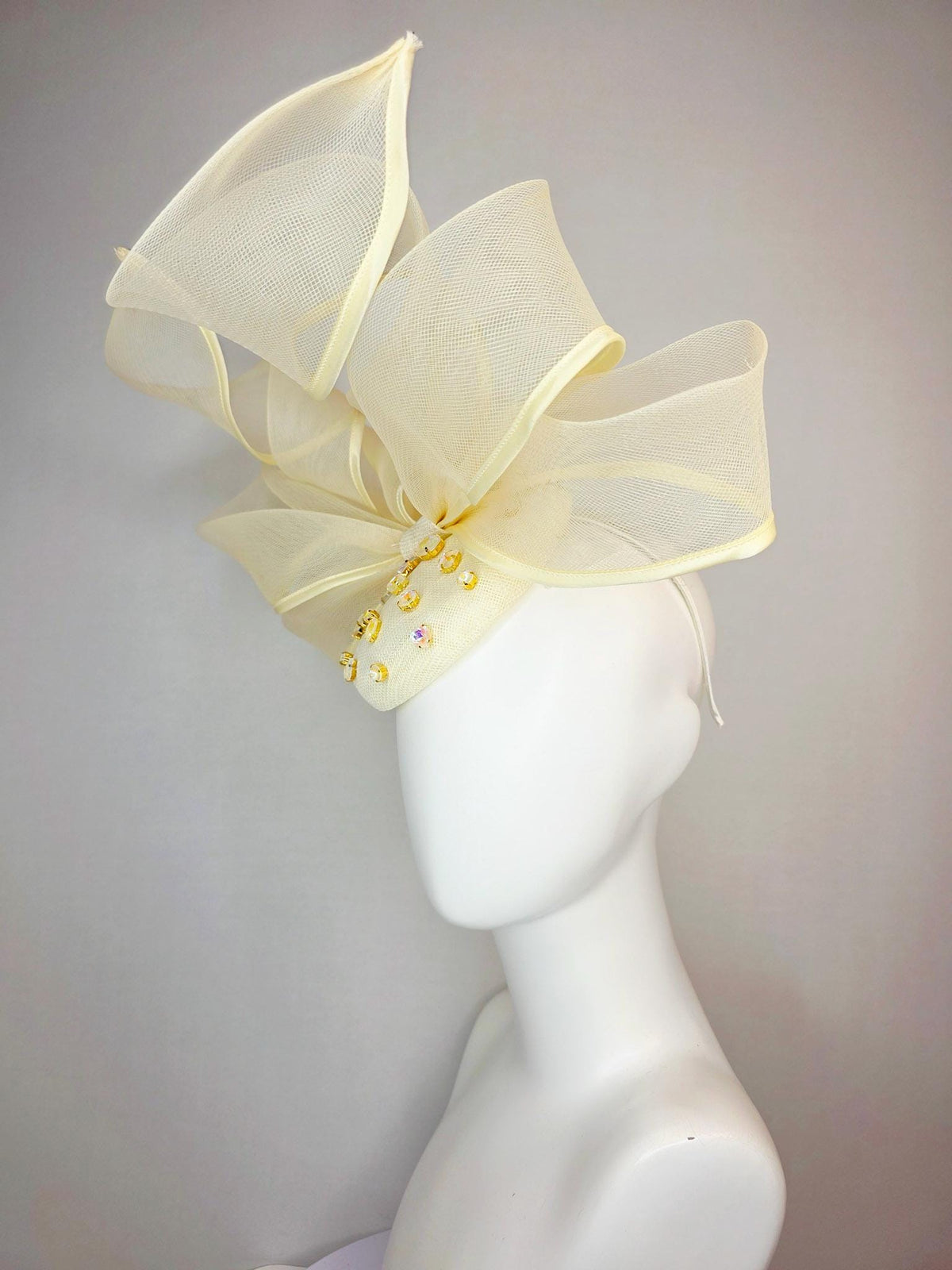 kentucky derby hat fascinator light yellow sinamay base with iridescent yellow crystal jewels mesh wired ribbon large bendable bow decor
