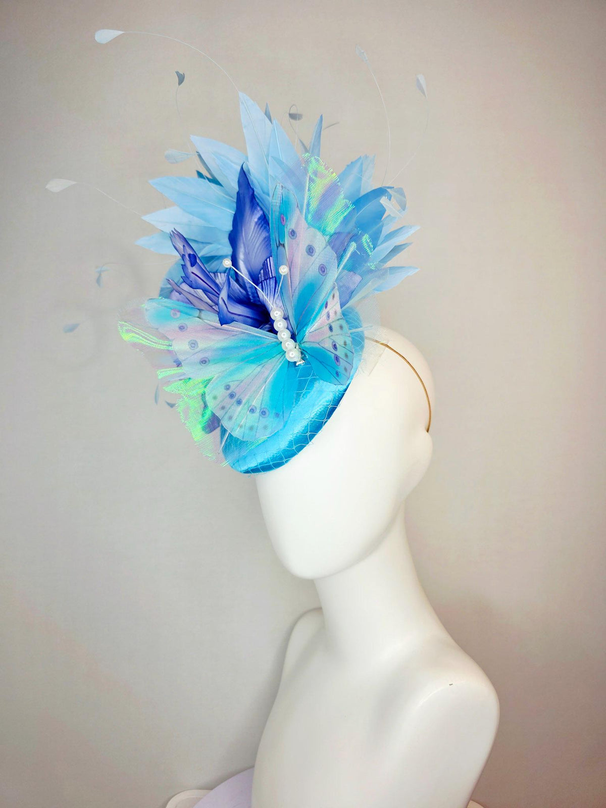 kentucky derby hat fascinator turquoise blue satin with netting ombre royal blue satin flower sky blue feathers large blue butterfly