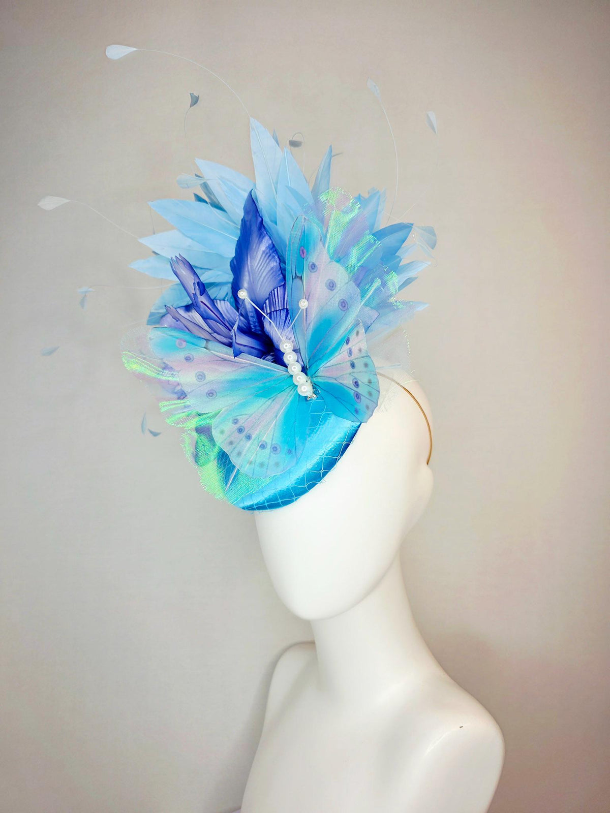 kentucky derby hat fascinator turquoise blue satin with netting ombre royal blue satin flower sky blue feathers large blue butterfly