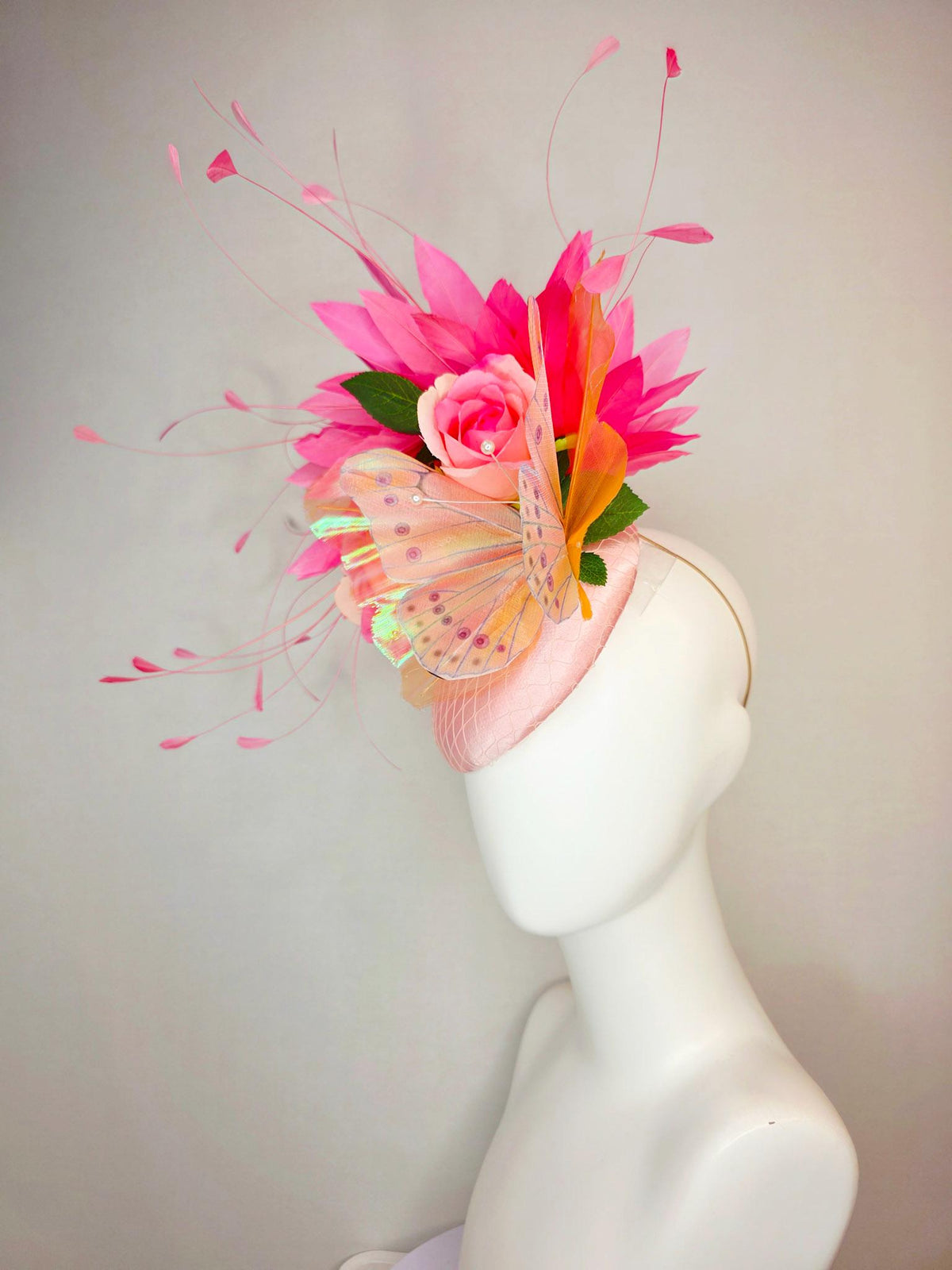 kentucky derby hat fascinator light pink satin with netting ombre peach yellow pink satin roses green leaves pink feathers large butterfly