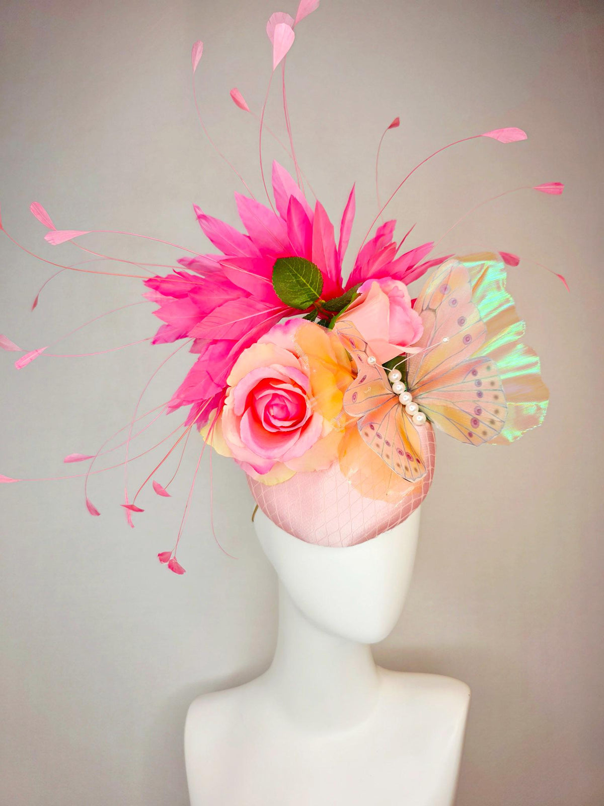 kentucky derby hat fascinator light pink satin with netting ombre peach yellow pink satin roses green leaves pink feathers large butterfly