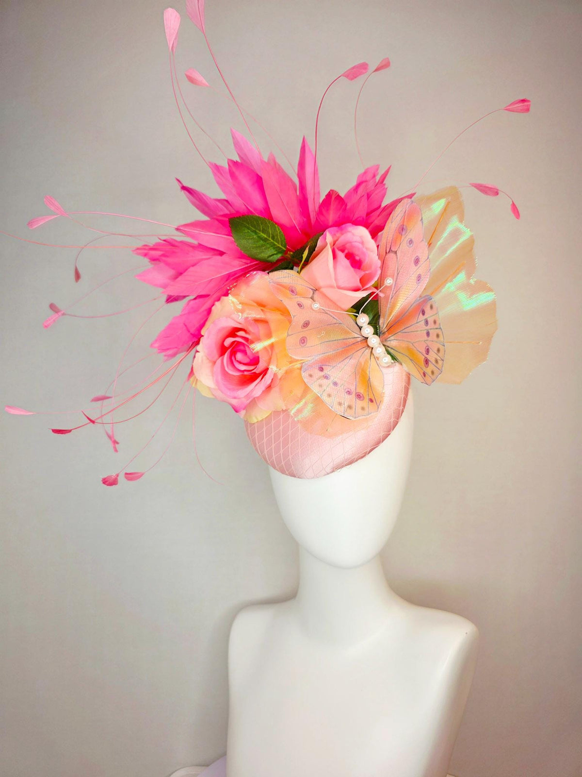 kentucky derby hat fascinator light pink satin with netting ombre peach yellow pink satin roses green leaves pink feathers large butterfly