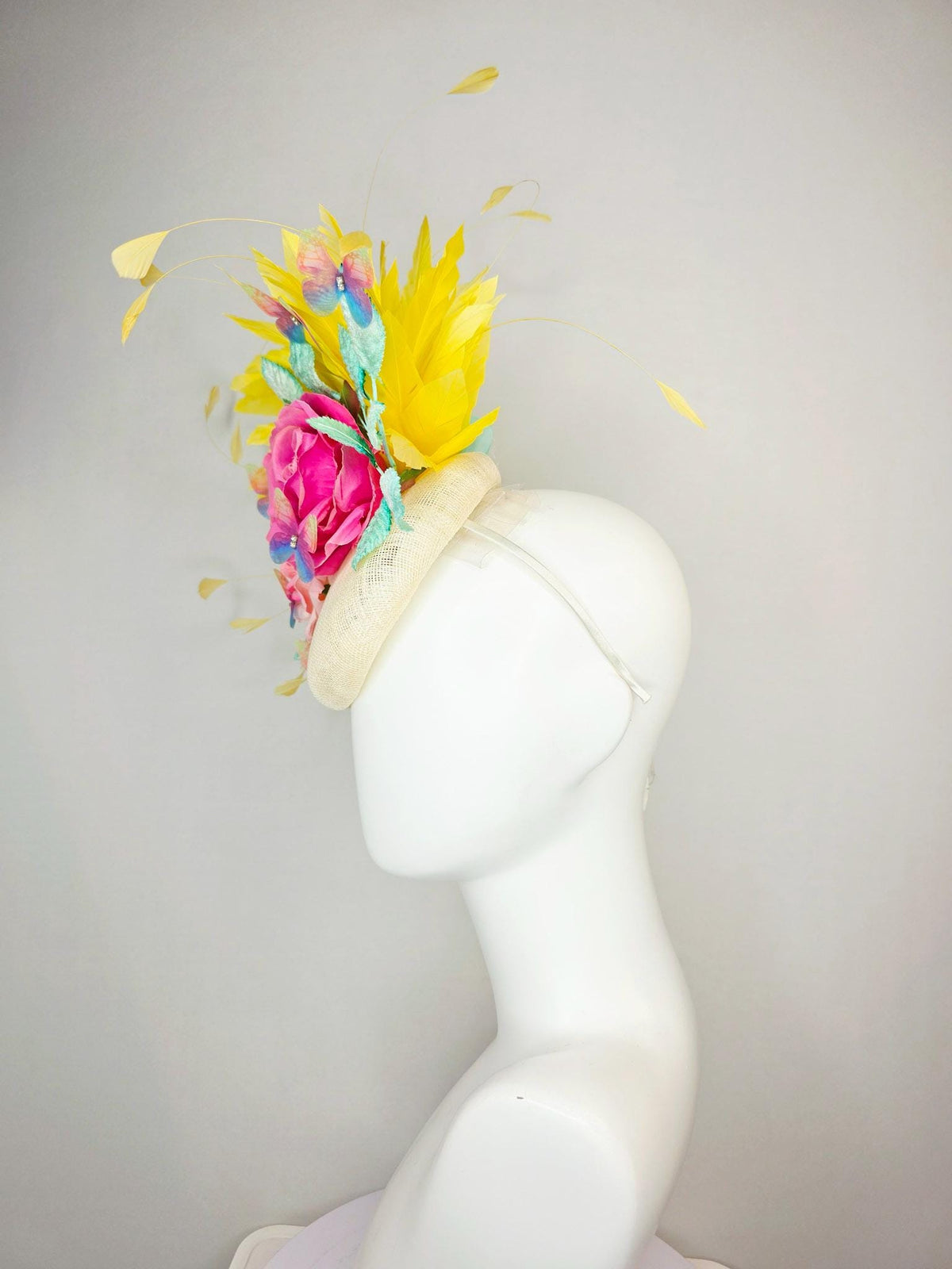 kentucky derby hat fascinator neutral ivory white sinamay and pink satin roses mint green leaves yellow feathers blue blush pink butterflies