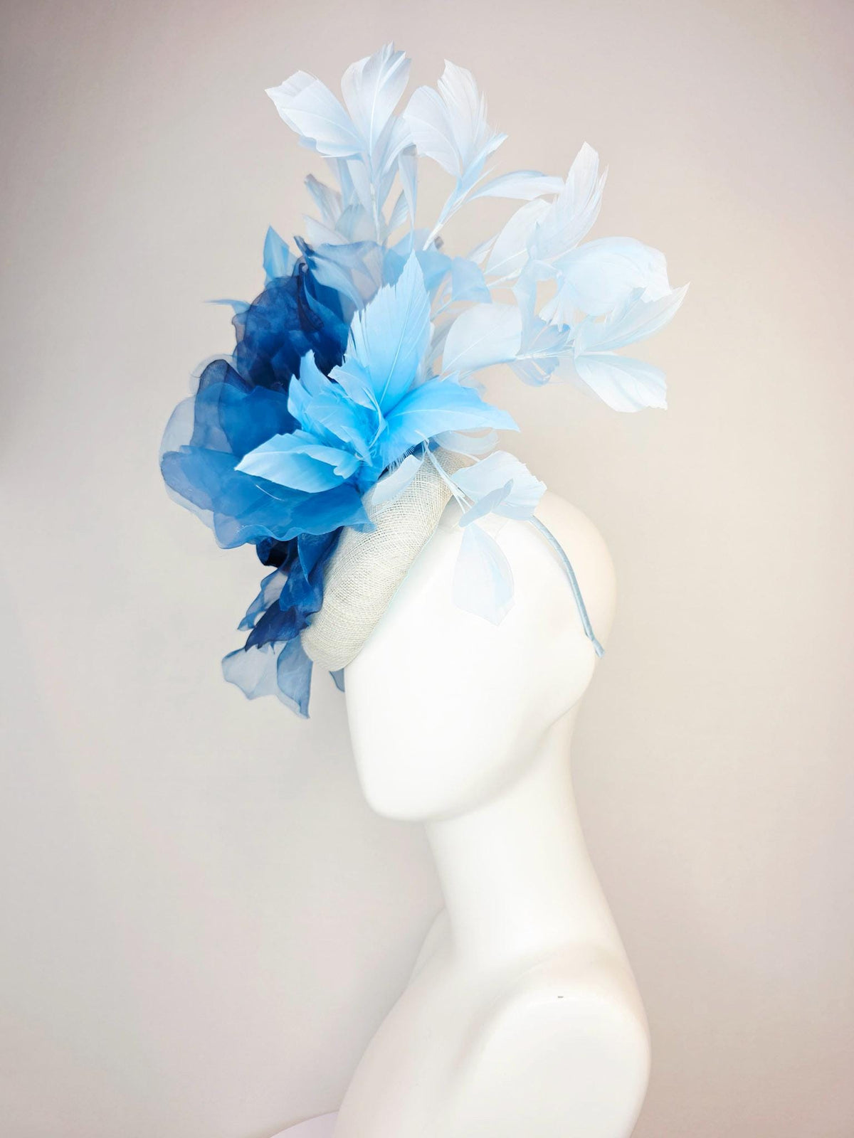 kentucky derby hat fascinator ivory white sinamay with large cobalt royal blue organza flower and light baby sky blue branching feathers