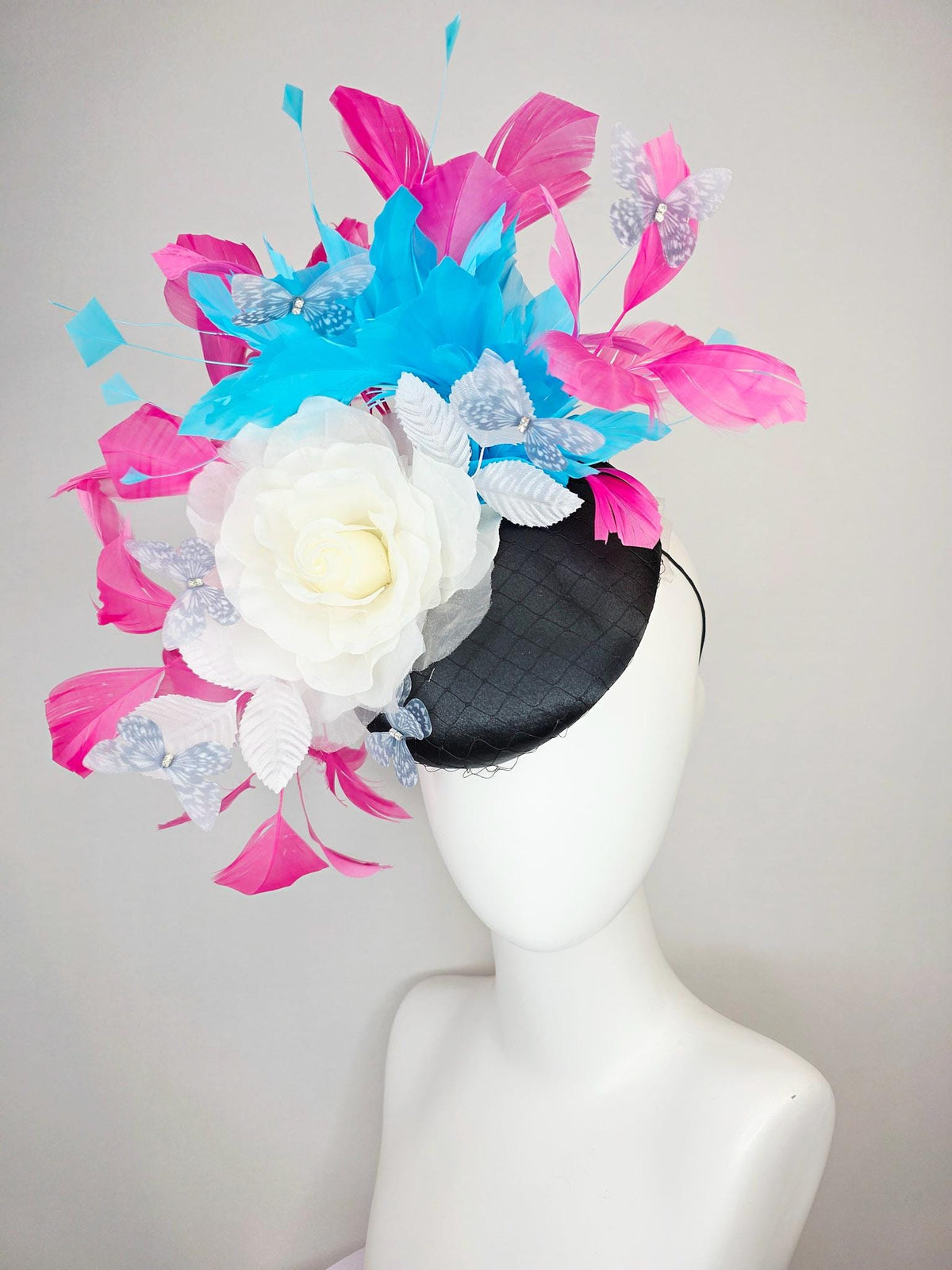 kentucky derby hat fascinator black satin with netting ivory white organza rose white leaves pink sky blue feathers light gray butterflies