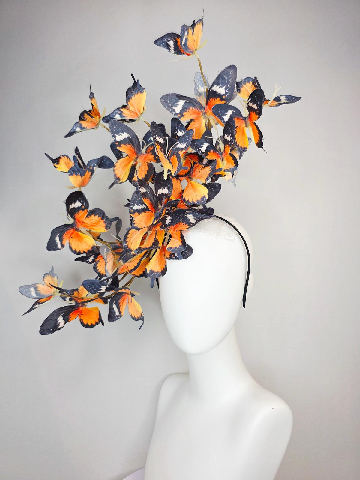 kentucky derby hat fascinator large branching warm burnt orange yellow black and white fabric butterflies on headband