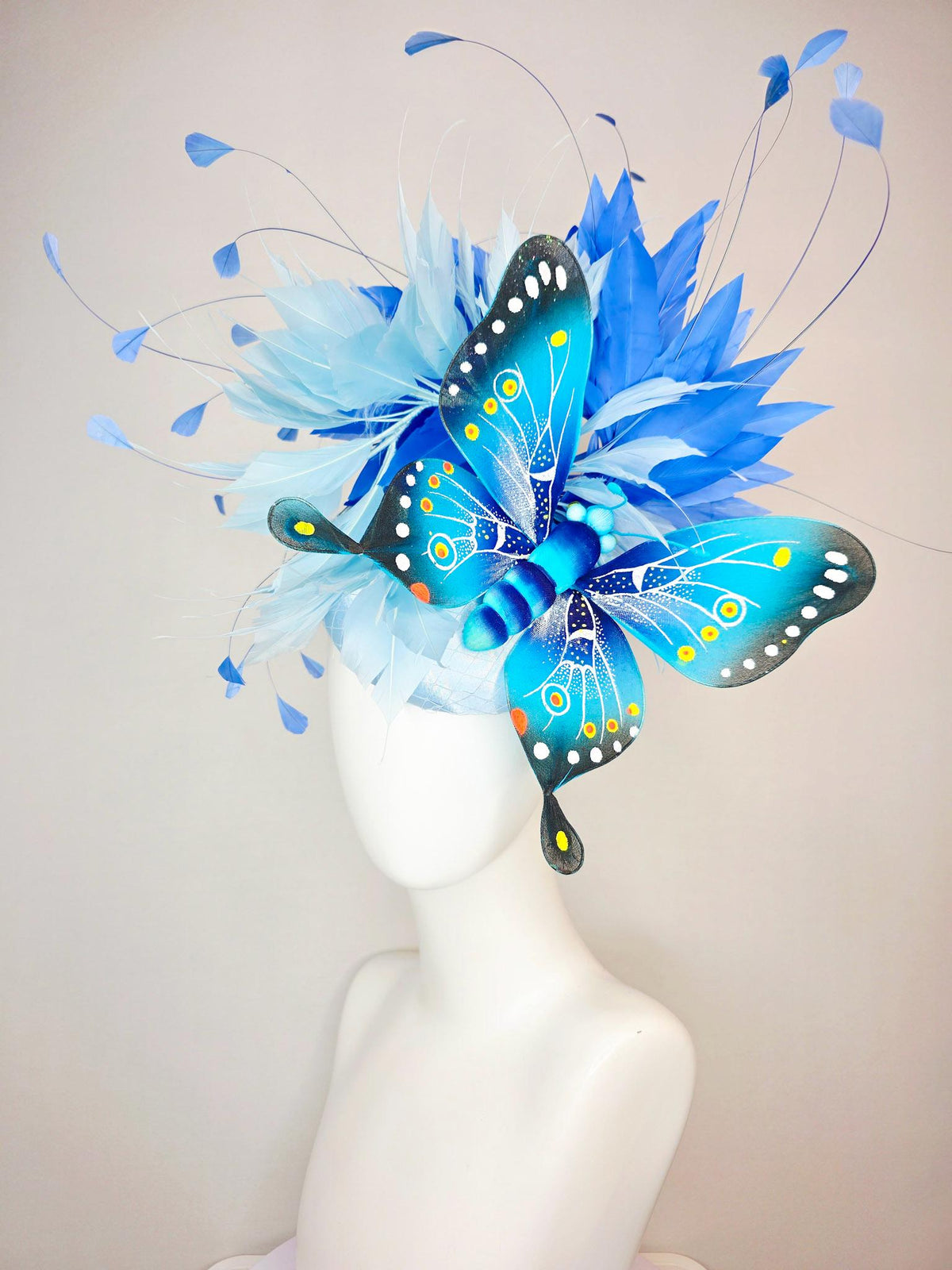 kentucky derby hat fascinator baby blue satin with netting light blue cobalt blue branching feathers large turquoise blue black butterfly
