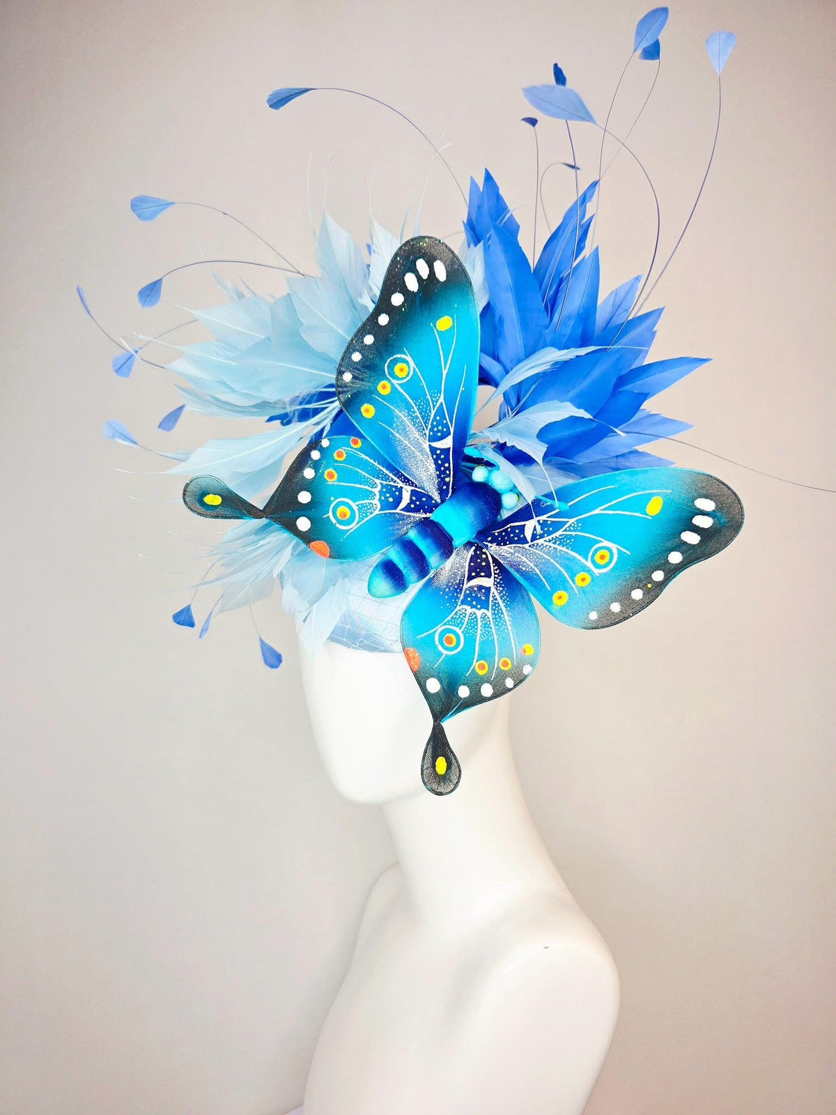 kentucky derby hat fascinator baby blue satin with netting light blue cobalt blue branching feathers large turquoise blue black butterfly