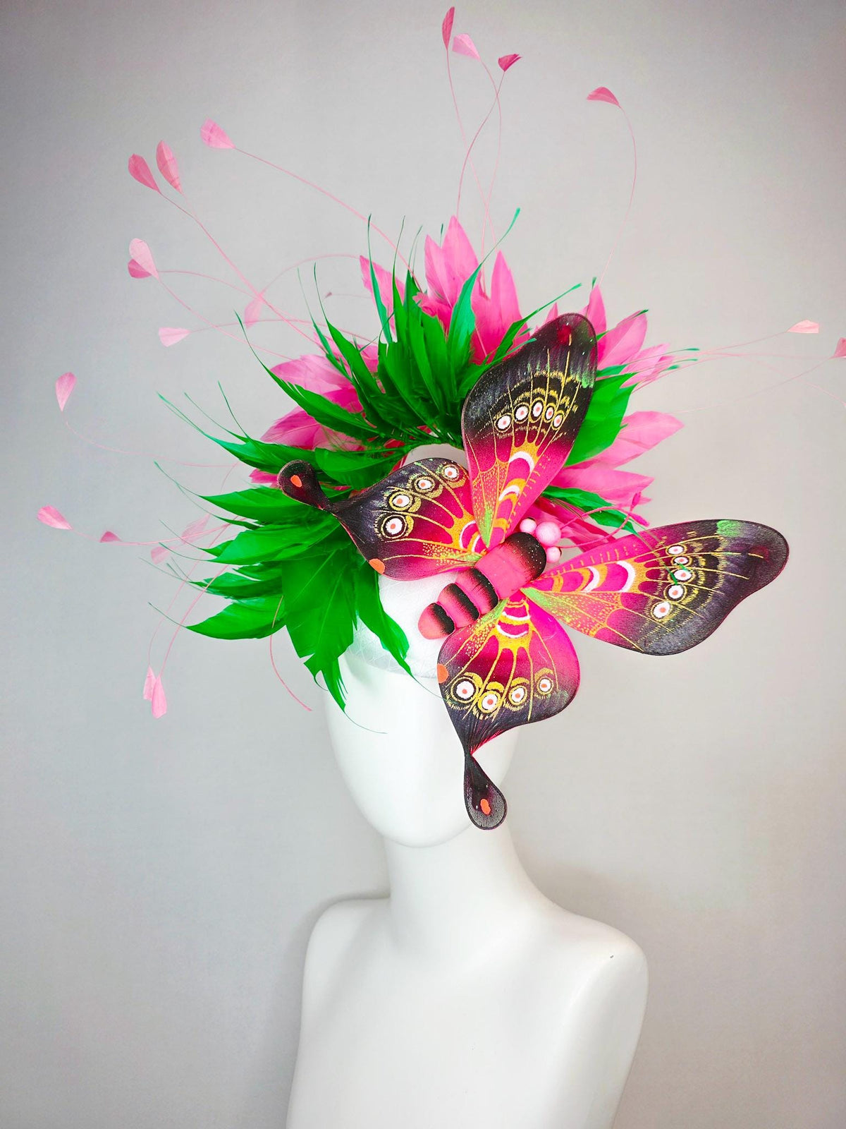 kentucky derby hat fascinator white satin with netting emerald green and hot pink branching feathers with large pink yellow black butterfly