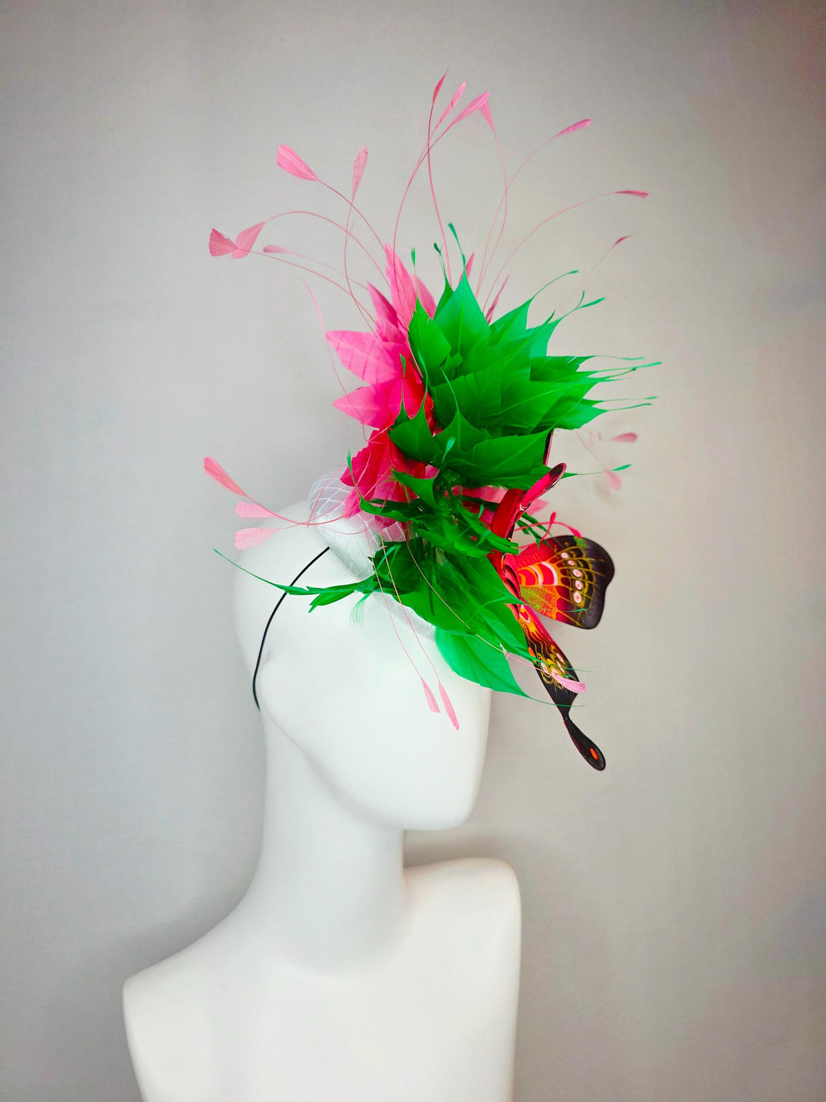 kentucky derby hat fascinator white satin with netting emerald green and hot pink branching feathers with large pink yellow black butterfly