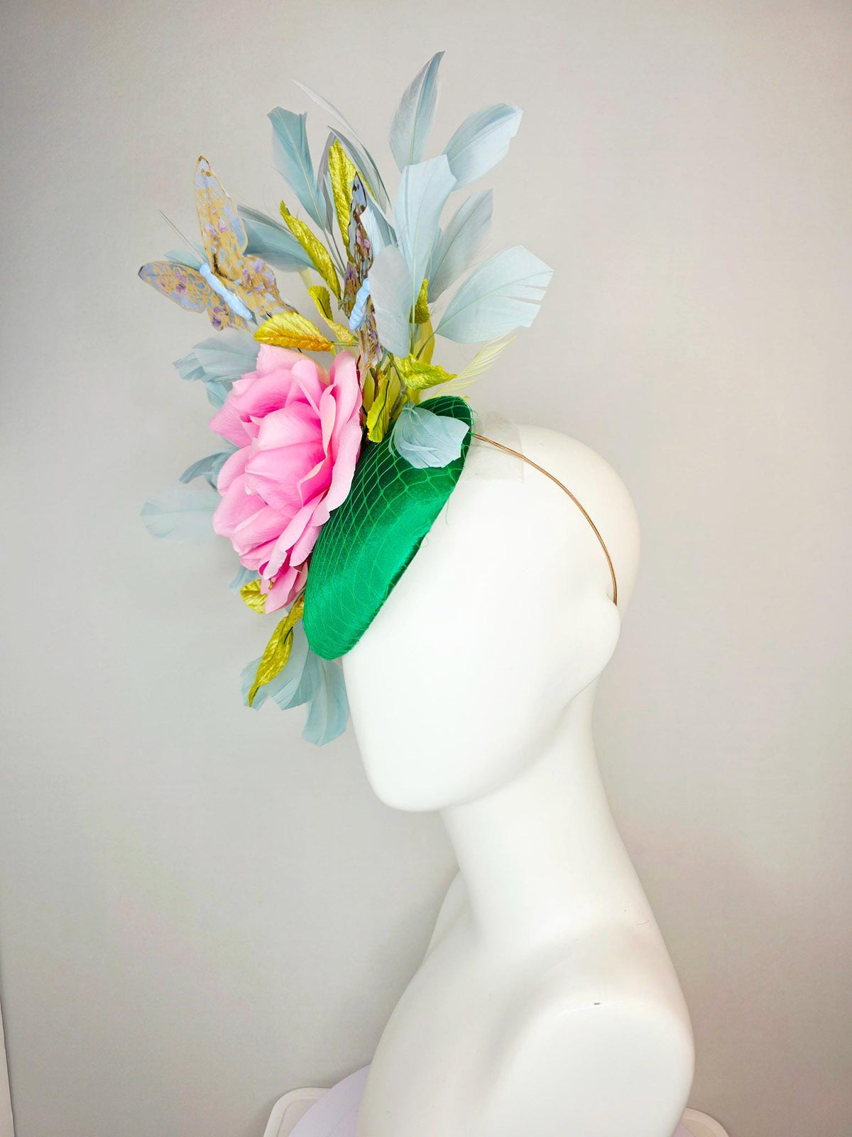 kentucky derby hat fascinator emerald green satin with netting blush pink satin rose lime yellow leaves gray blue feathers gold butterflies
