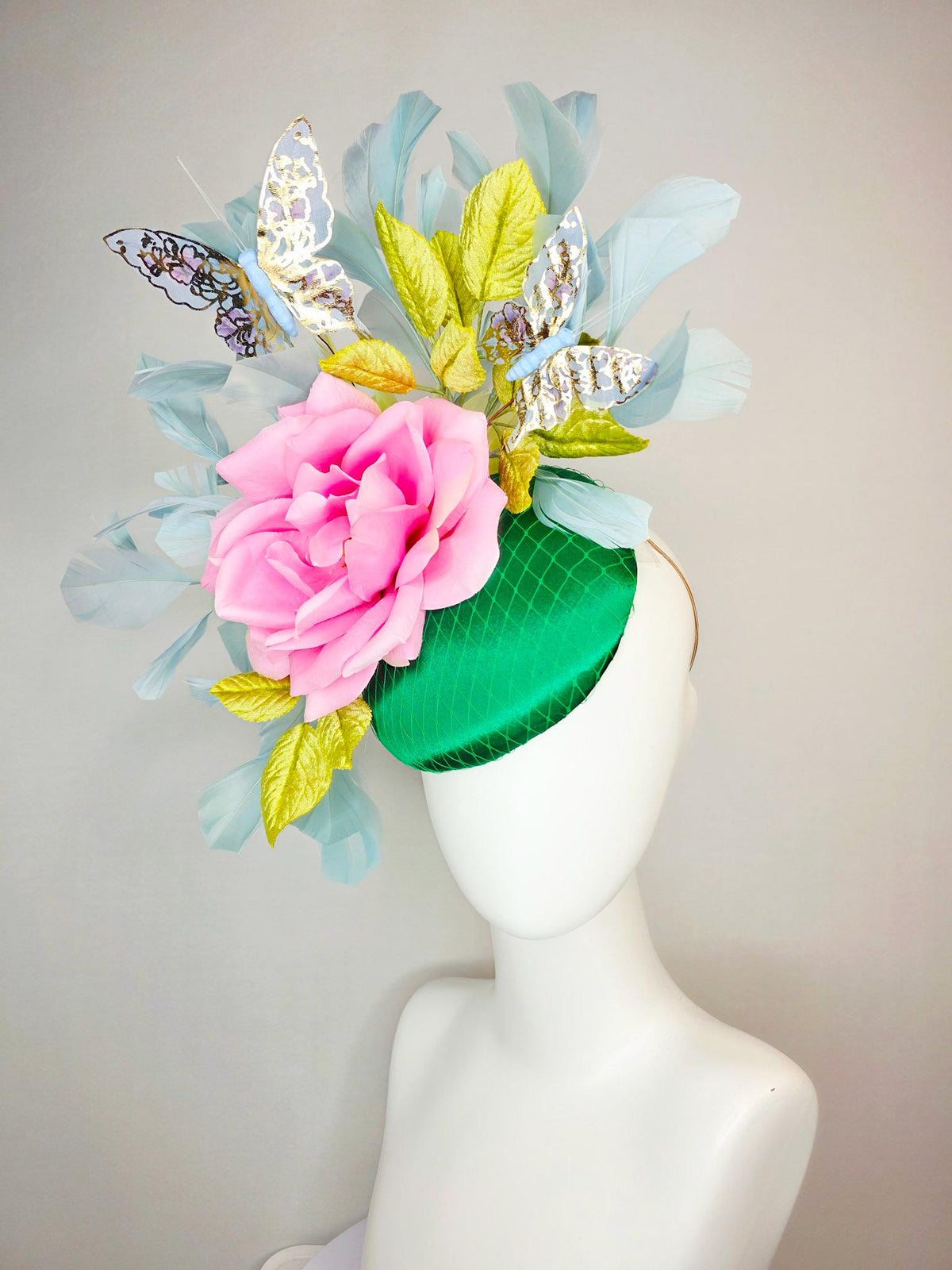 kentucky derby hat fascinator emerald green satin with netting blush pink satin rose lime yellow leaves gray blue feathers gold butterflies