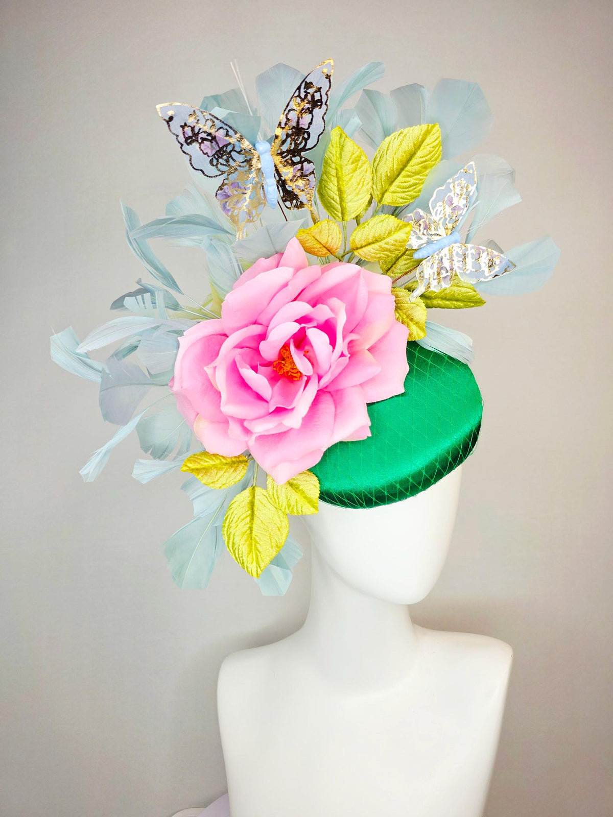 kentucky derby hat fascinator emerald green satin with netting blush pink satin rose lime yellow leaves gray blue feathers gold butterflies