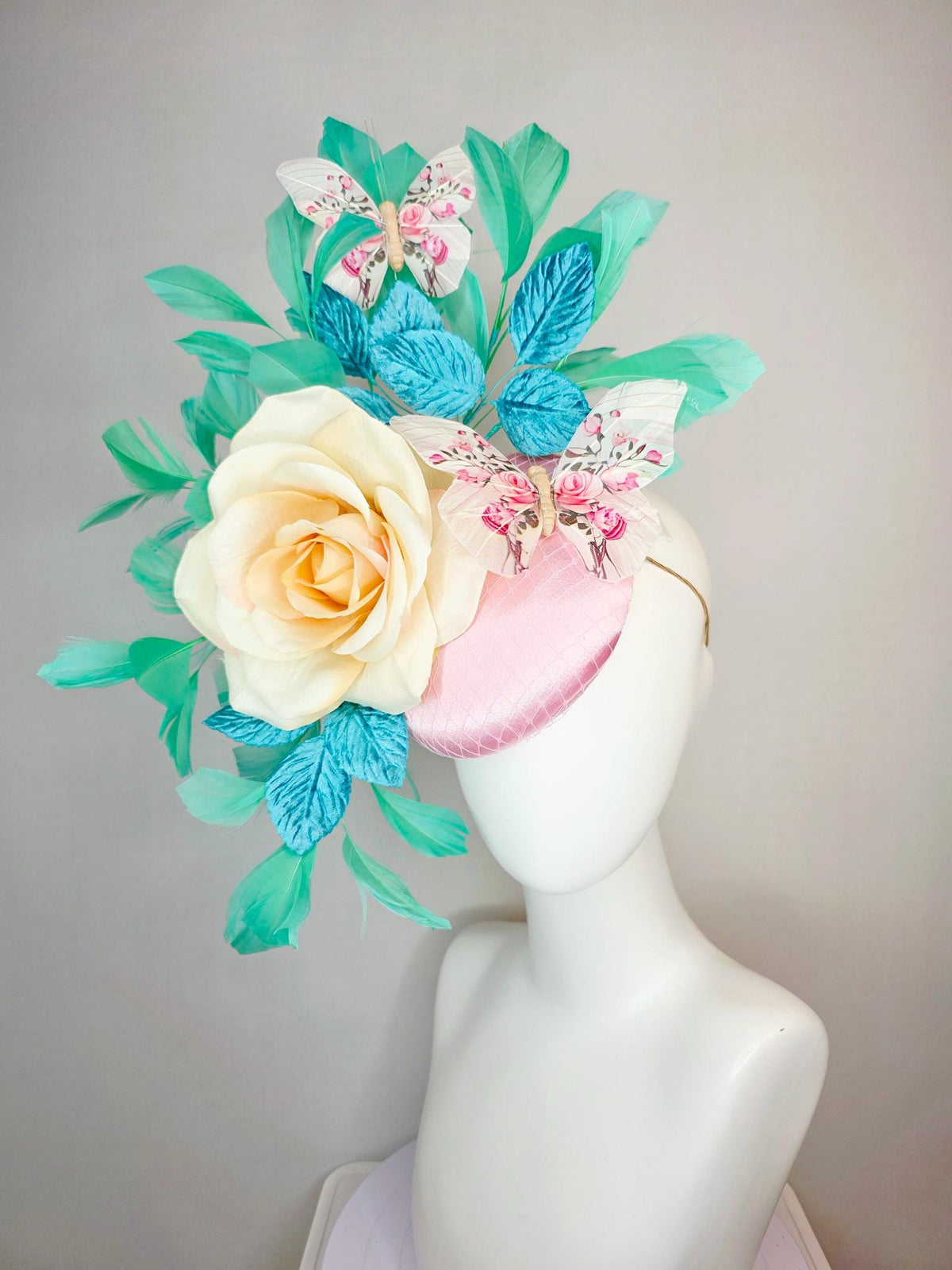 kentucky derby hat fascinator light pink satin with netting ivory cream satin rose turquoise blue leaves mint green feathers and butterflies