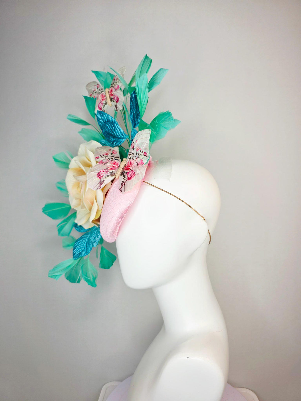 kentucky derby hat fascinator light pink satin with netting ivory cream satin rose turquoise blue leaves mint green feathers and butterflies
