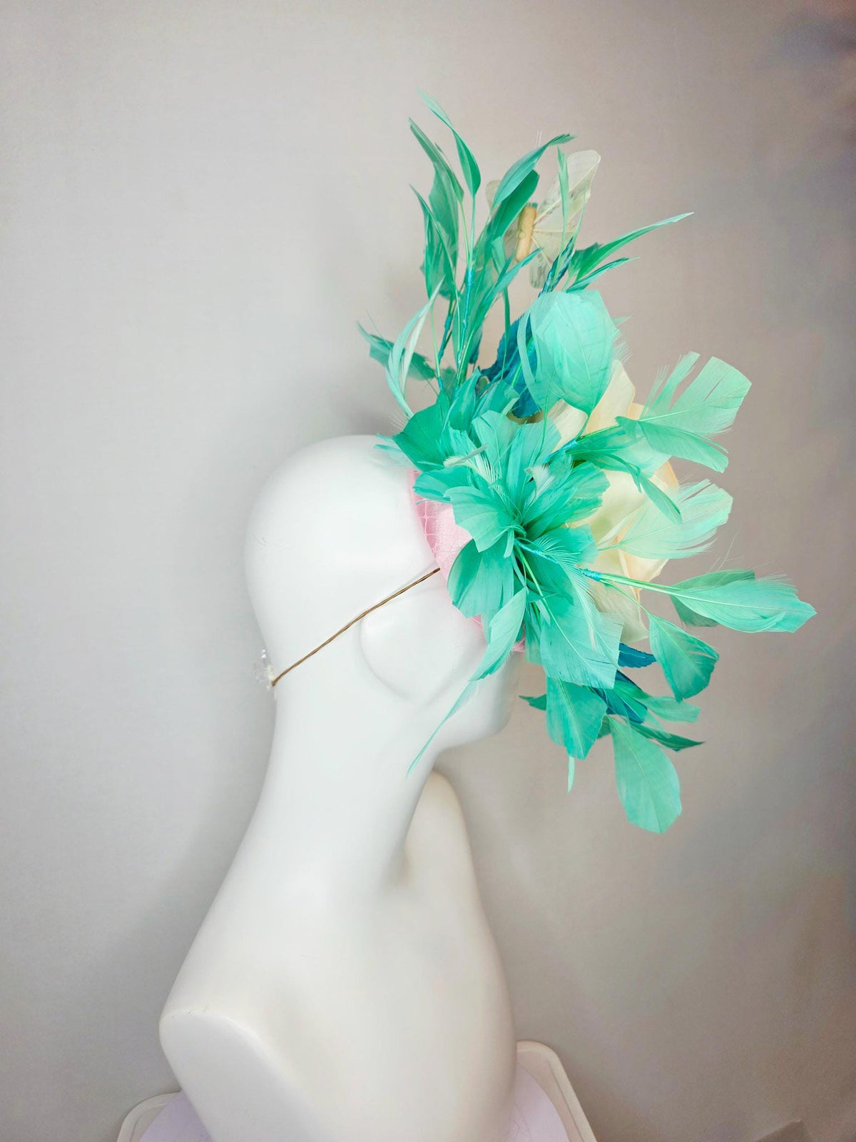kentucky derby hat fascinator light pink satin with netting ivory cream satin rose turquoise blue leaves mint green feathers and butterflies