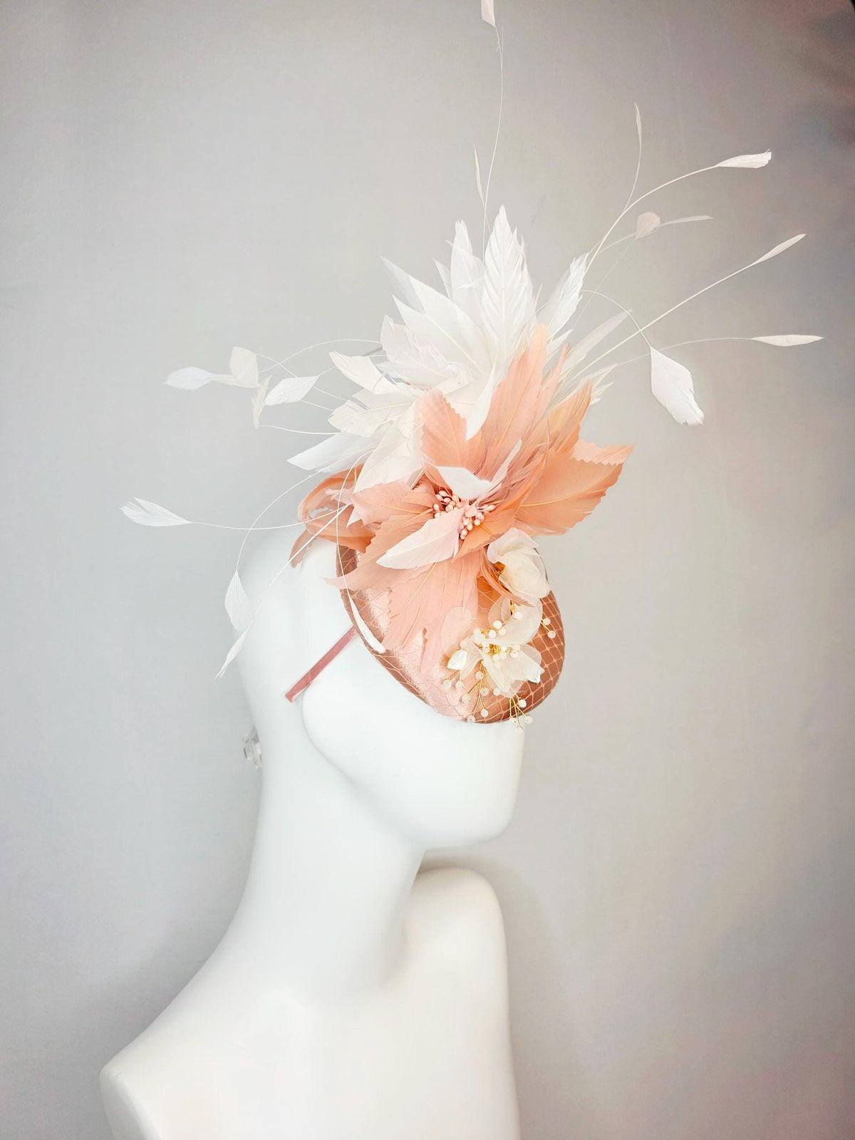 kentucky derby hat fascinator champagne pink satin with netting white organza flowers pearl strings dusty pink and white branching feathers