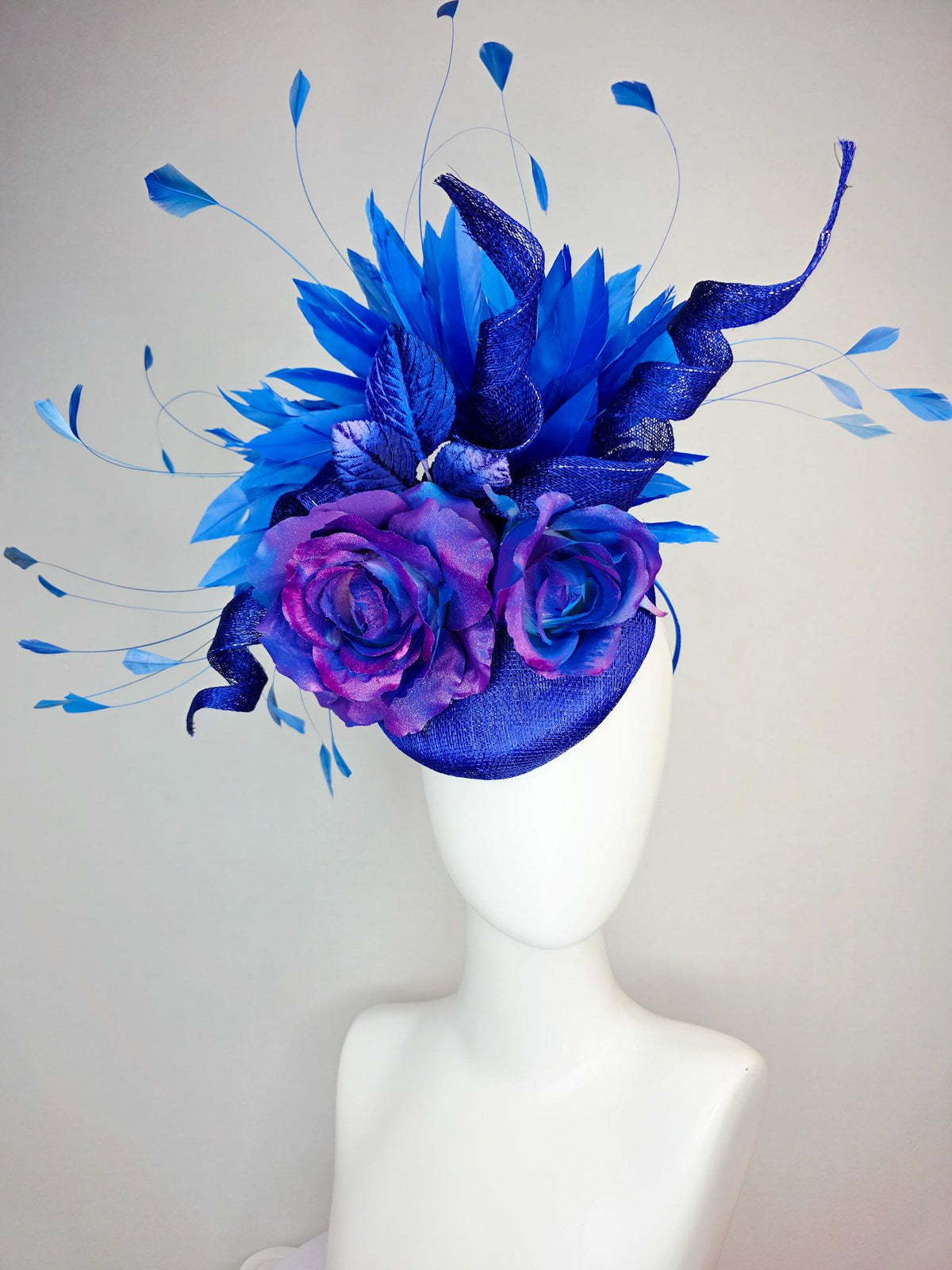 kentucky derby hat fascinator cobalt blue sinamay with curls ombre pink purple blue satin roses blue leaves royal blue branching feathers
